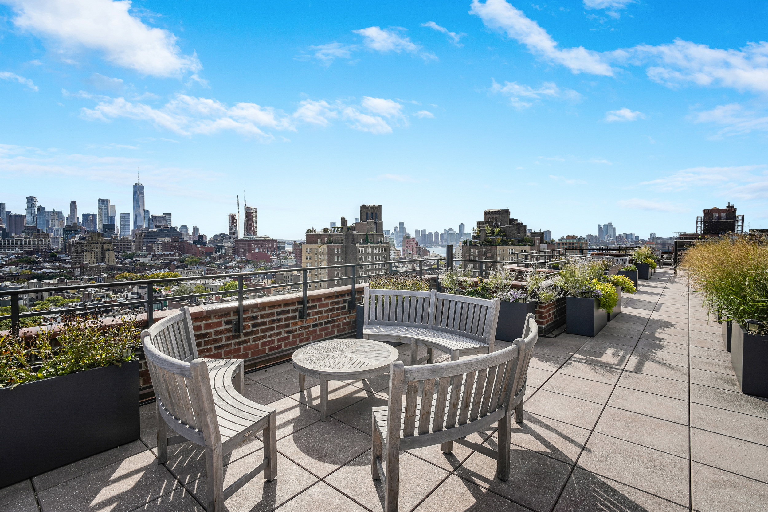 31 Jane Street, Unit 10FG Manhattan, NY 10014 - Photo 23 of 27 a view of a chairs and table in the terrace