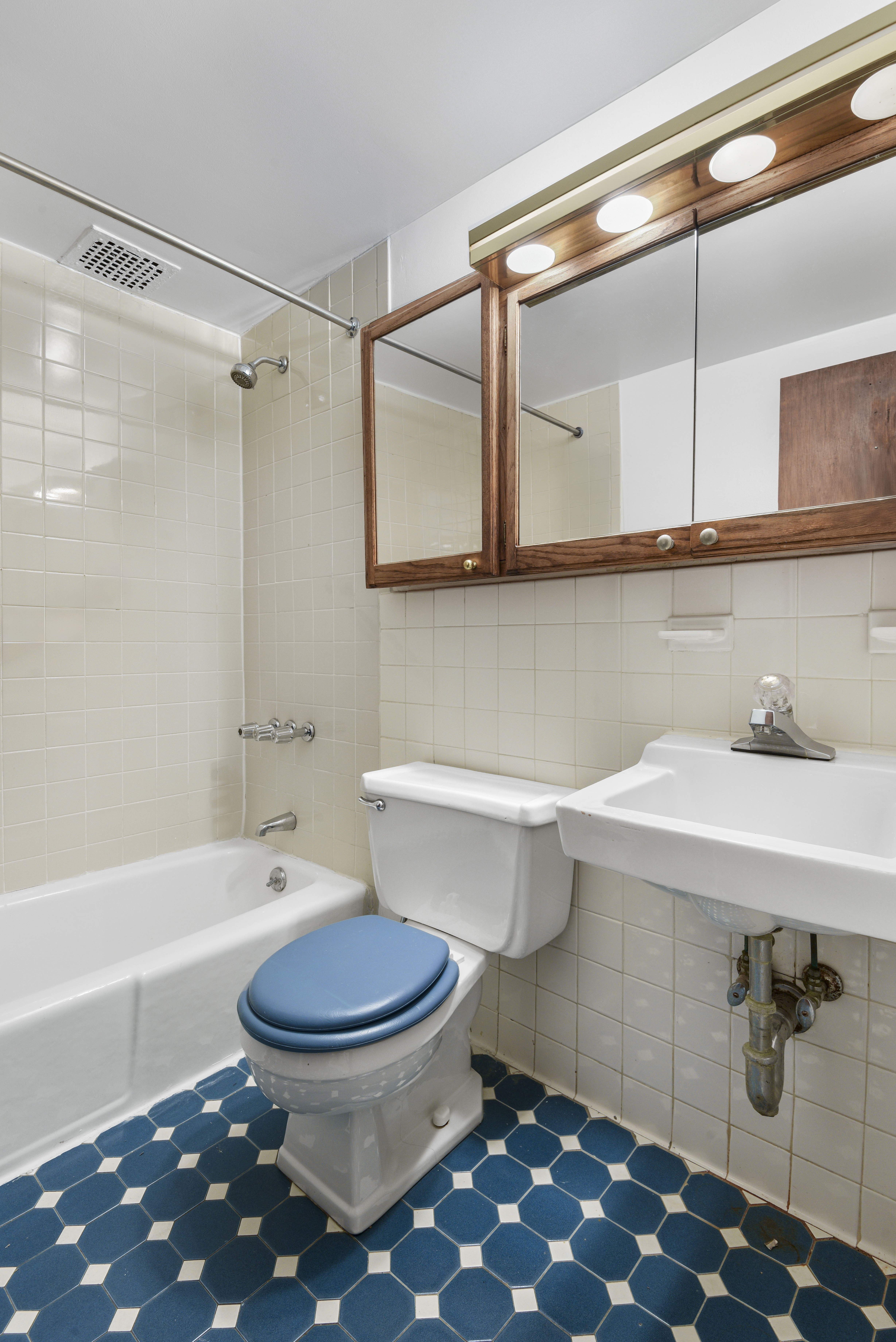146 West 80th Street, Unit BR Manhattan, NY 10024 - Photo 15 of 16 a bathroom with a sink a toilet and shower
