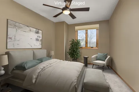 a bedroom with a bed and window