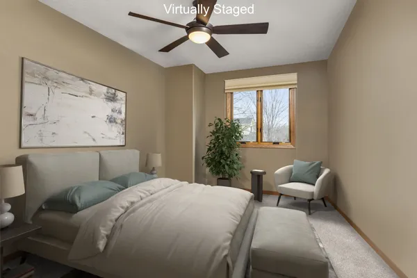 a bedroom with a bed and window