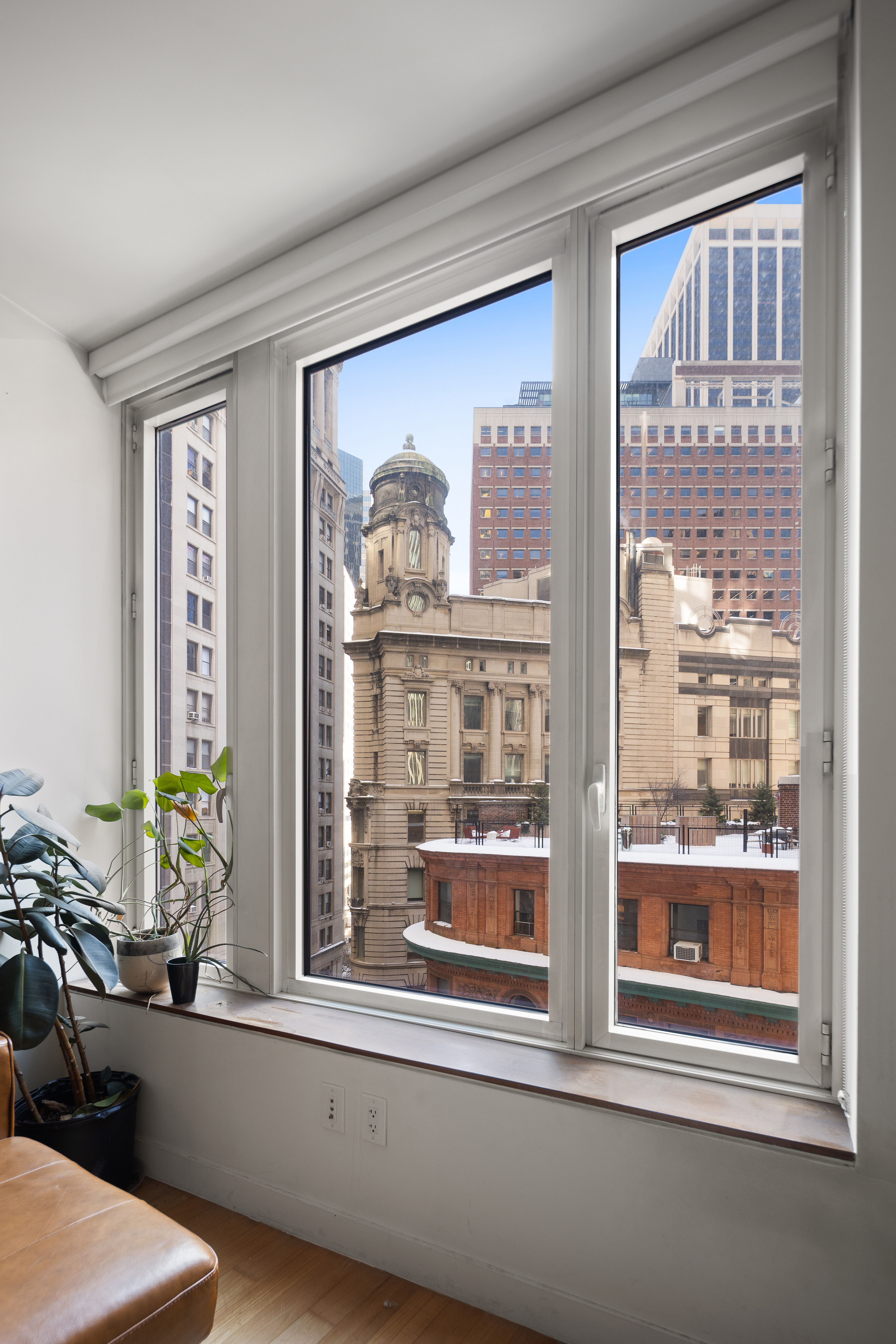 15 William Street, Unit 10C Manhattan, NY 10005 - Photo 2 of 15 a view of a living room and window