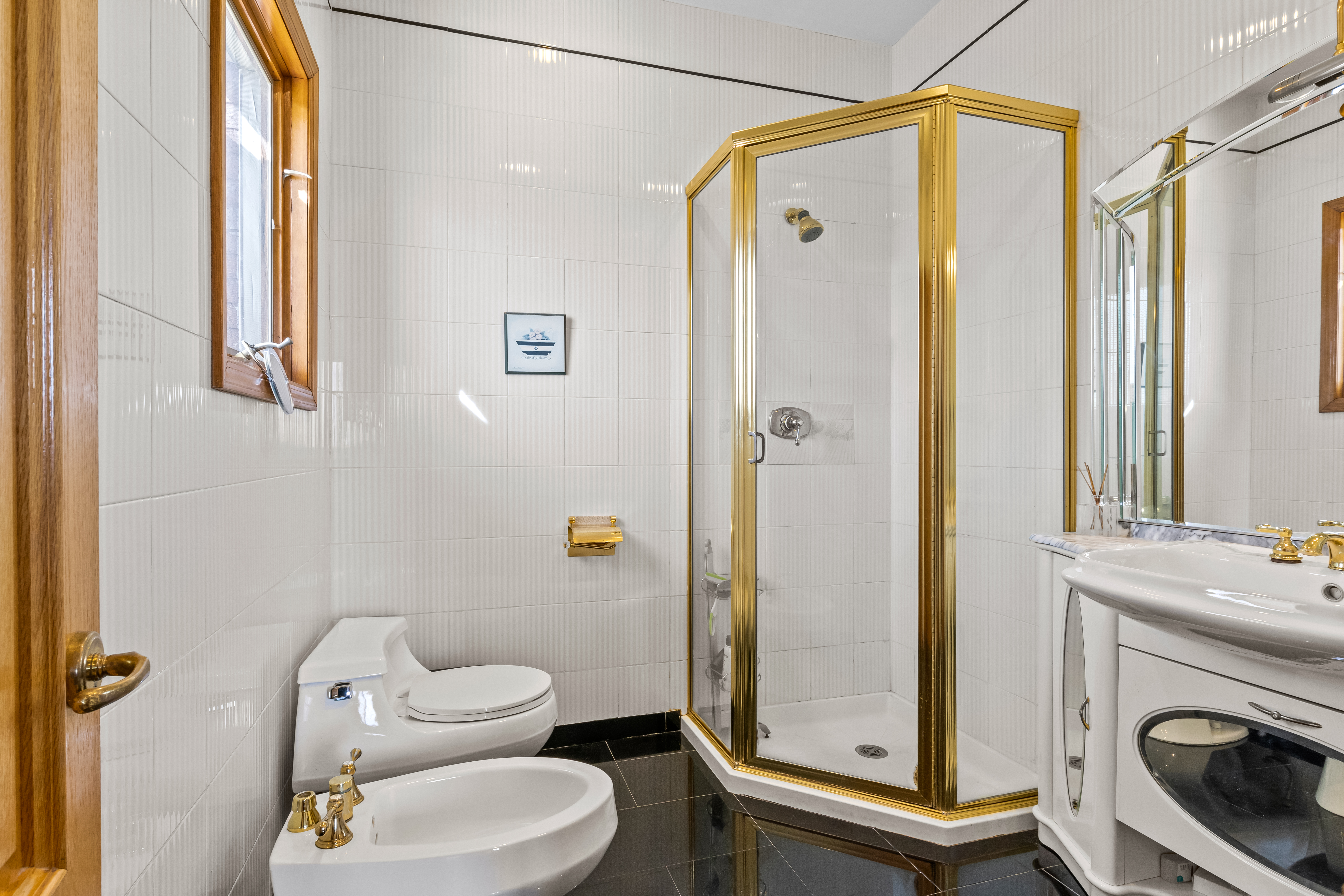 303 Whitman Drive Brooklyn, NY 11234 - Photo 18 of 37 a bathroom with a shower a toilet and a sink