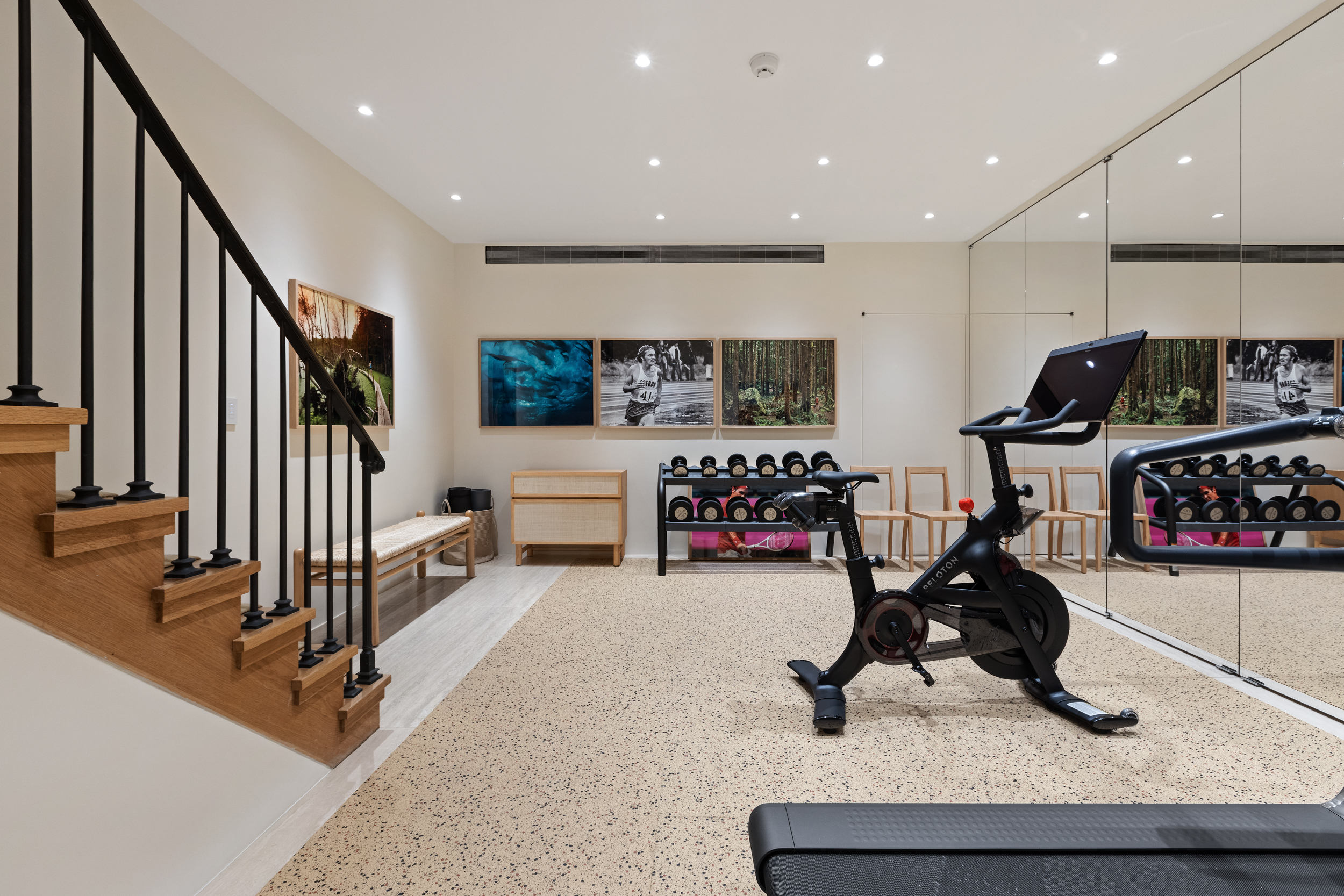 45 East 74th Street Manhattan, NY 10021 - Photo 27 of 33 a view of a room with gym equipment and lots of wooden furniture