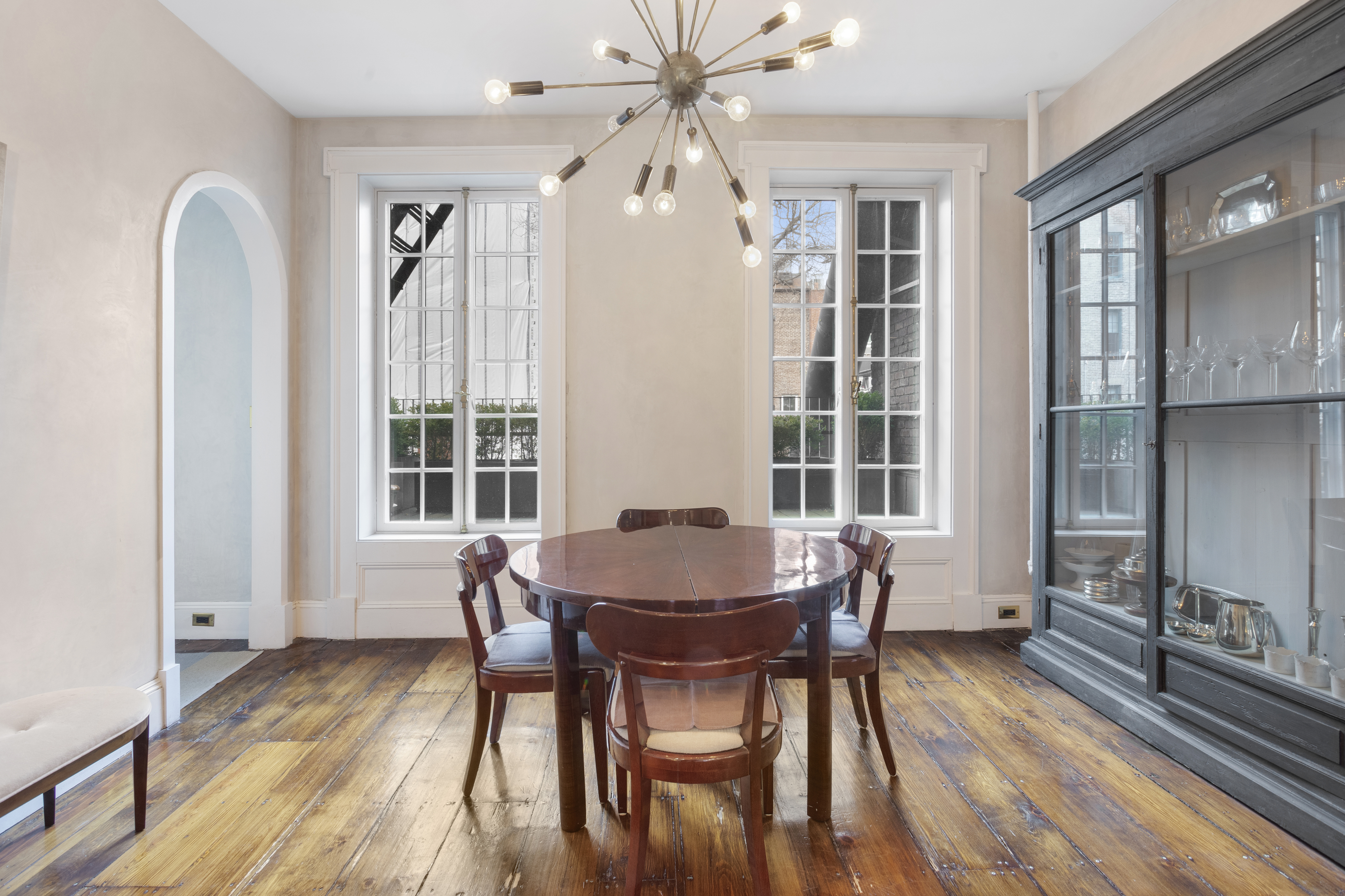 75 Washington Place, Unit TRIPLEX Manhattan, NY 10011 - Photo 11 of 14 a view of a dining room with furniture and wooden floor