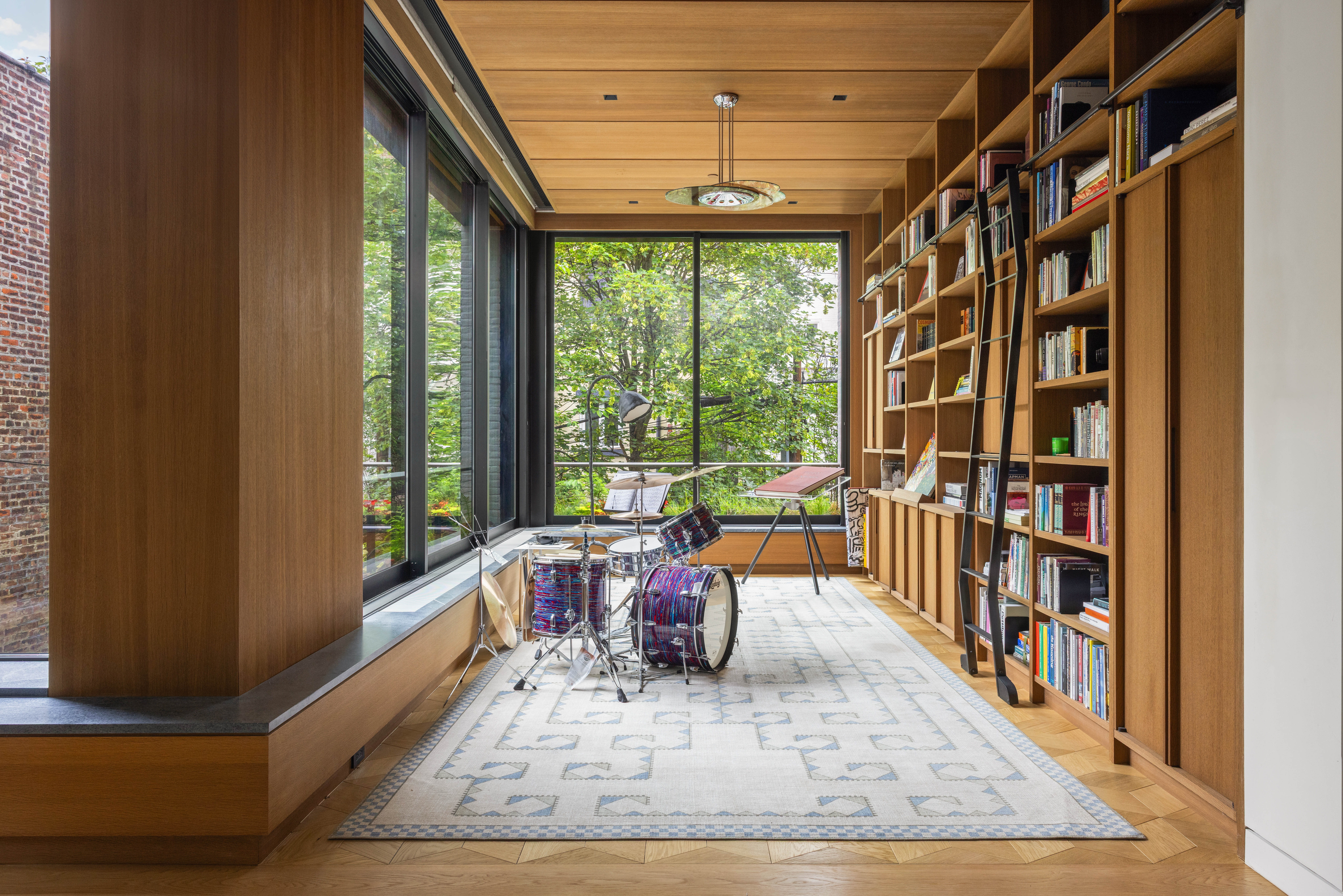 535 1st Street Brooklyn, NY 11215 - Photo 11 of 36 a living room with lots of furniture and a book shelf