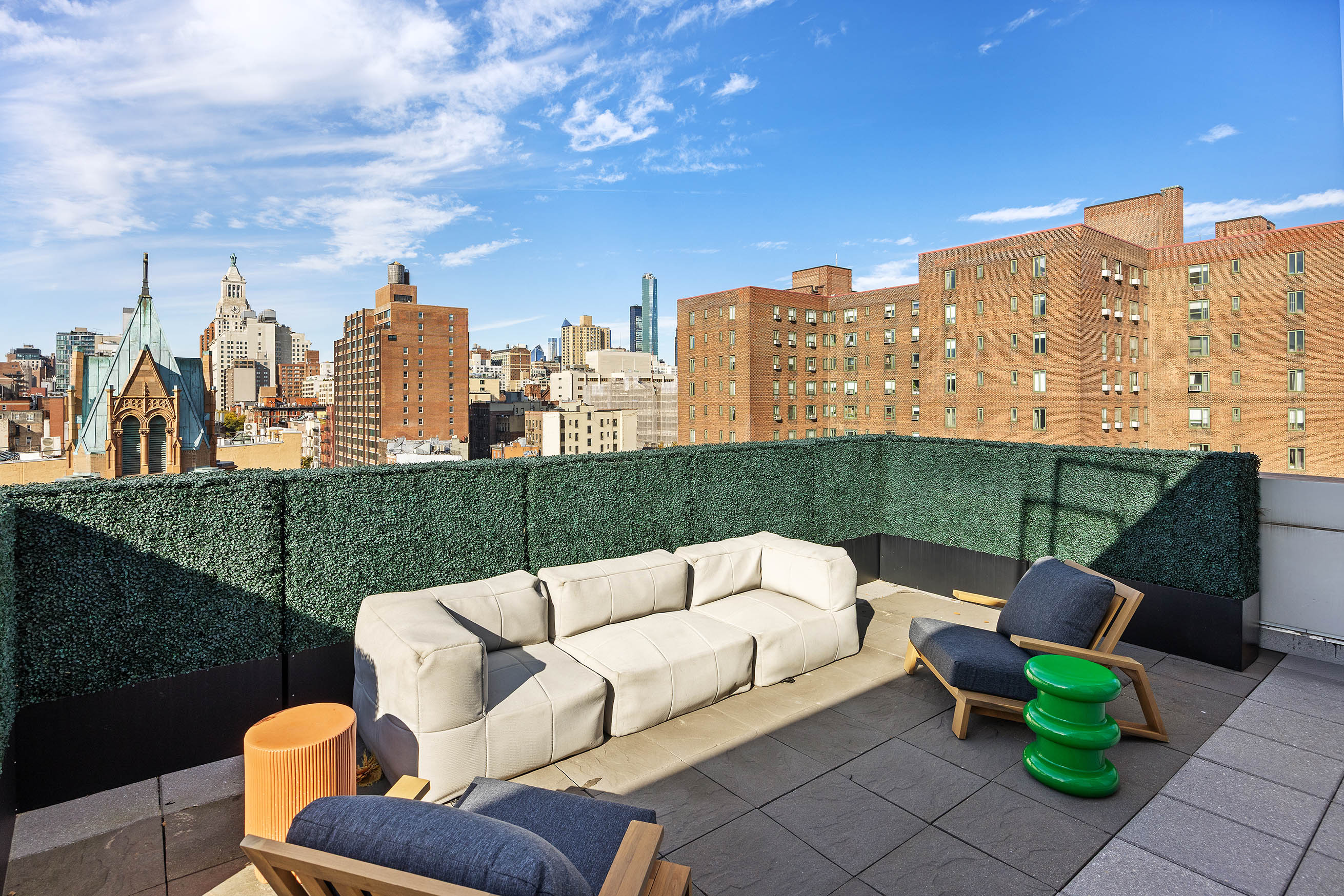 425 East 13th Street, Unit PHFG Manhattan, NY 10009 - Photo 24 of 31 a view of a terrace with couches and pool