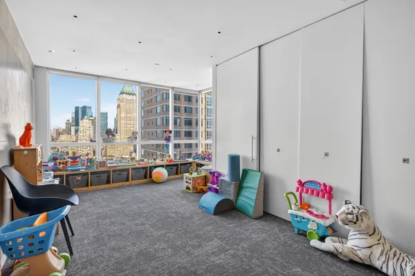 a utility room with multiple dryer and washer