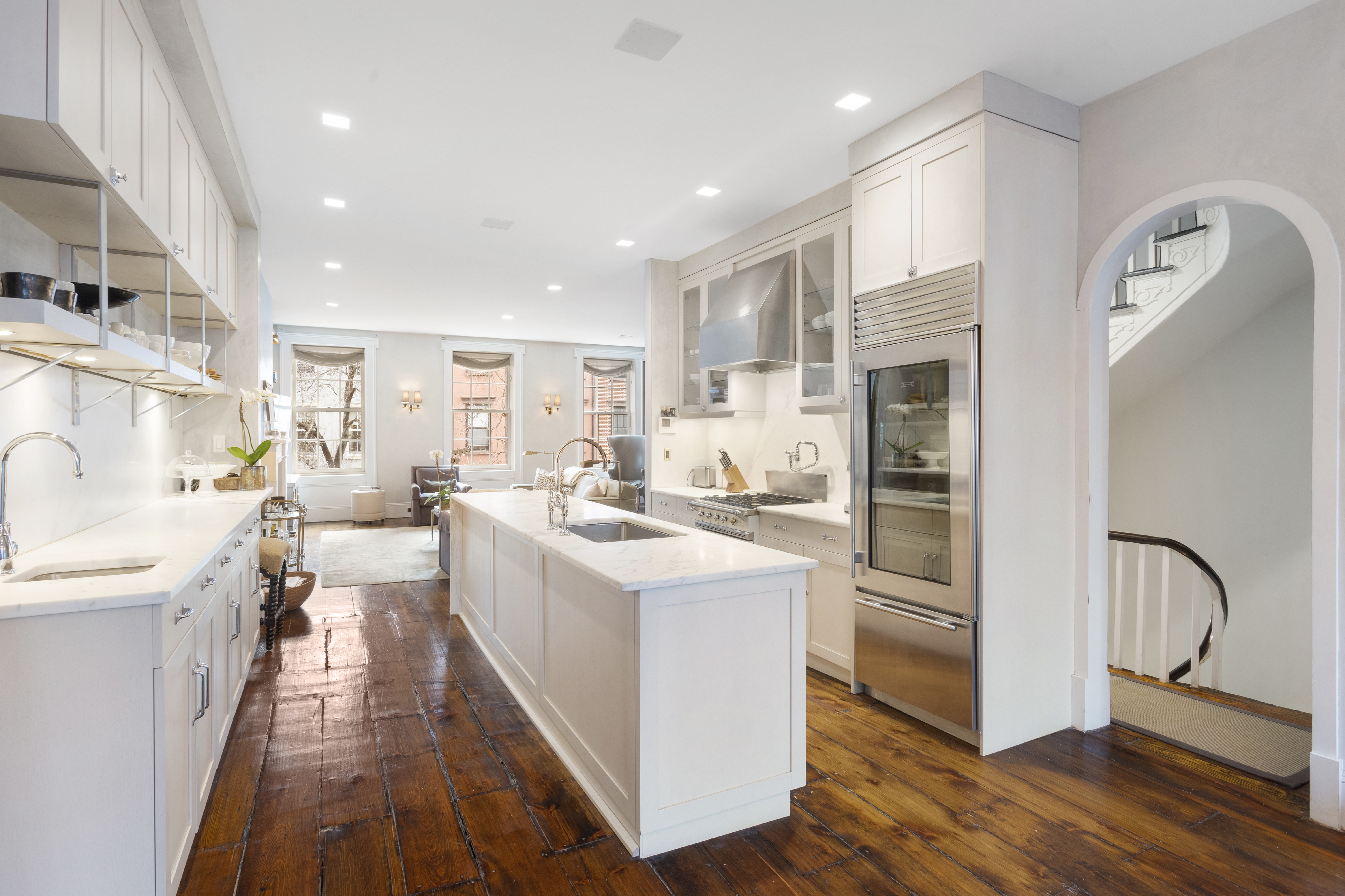 75 Washington Place, Unit TRIPLEX Manhattan, NY 10011 - Photo 3 of 14 a kitchen with white cabinets and sink
