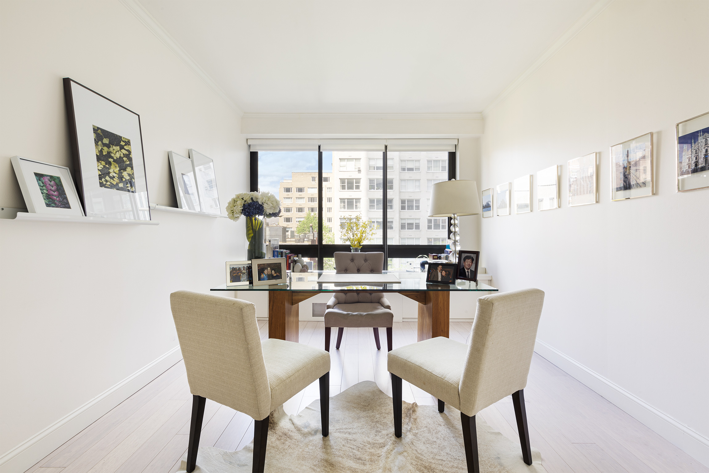 167 East 61st Street, Unit 7C Manhattan, NY 10065 - Photo 5 of 7 a dining room with furniture and window