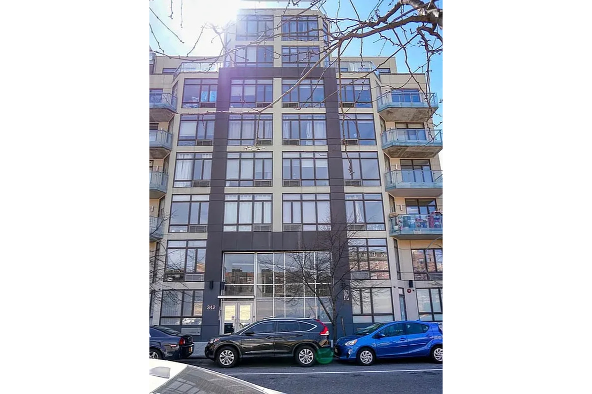 342 East 110th Street, Unit 5E Manhattan, NY 10029 - Photo 17 of 18 a car parked in front of a building