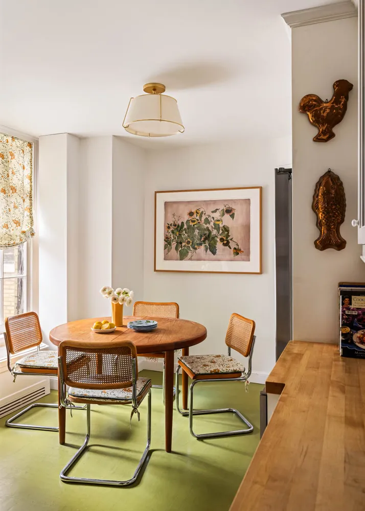 a front view of a house with garden and trees