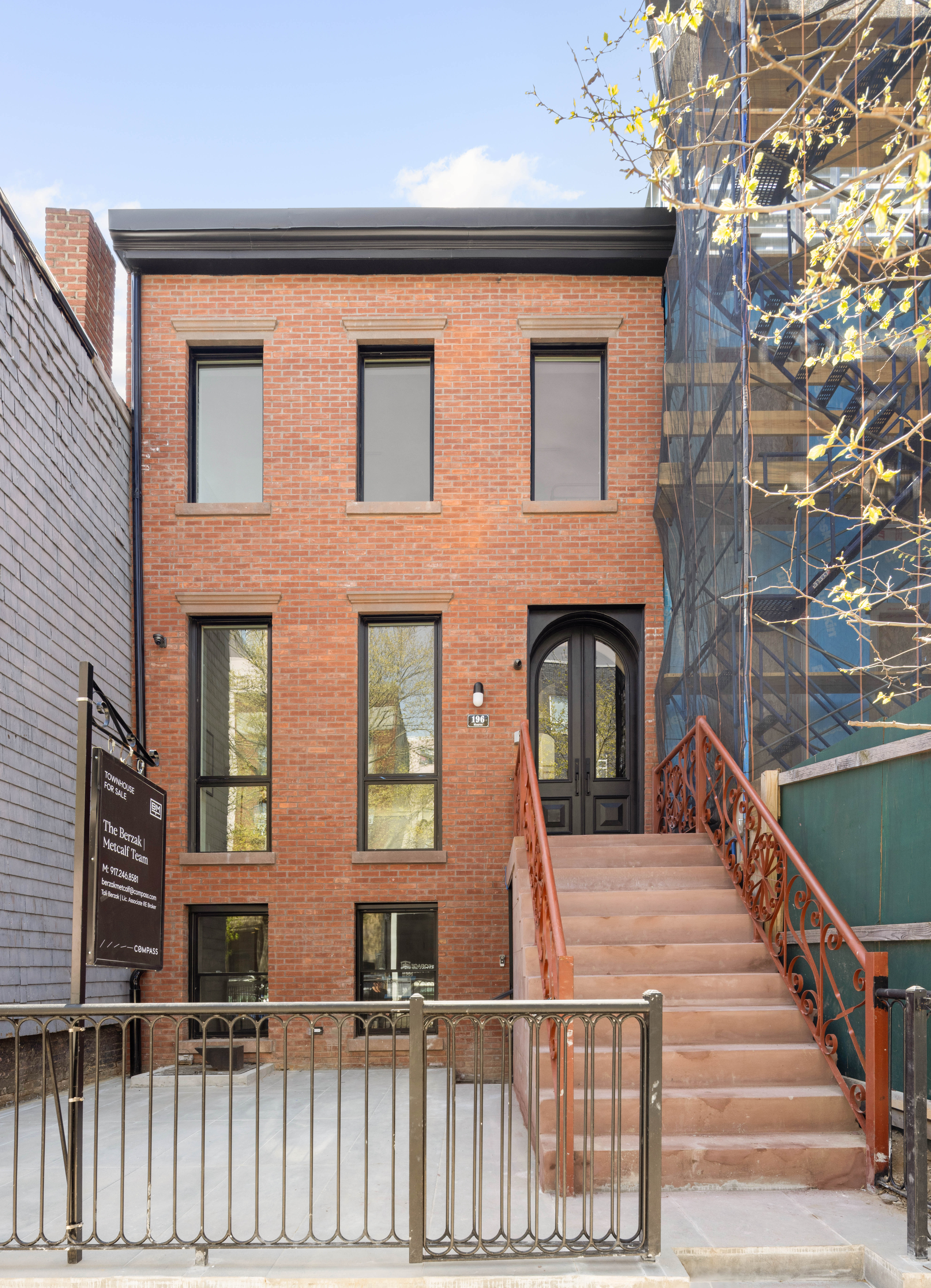 196 Monroe Street Brooklyn, NY 11216 - Photo 20 of 22 a view of a brick house with many windows