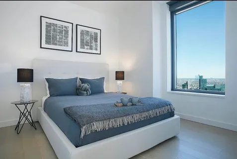 a bathroom with a sink mirror vanity and toilet