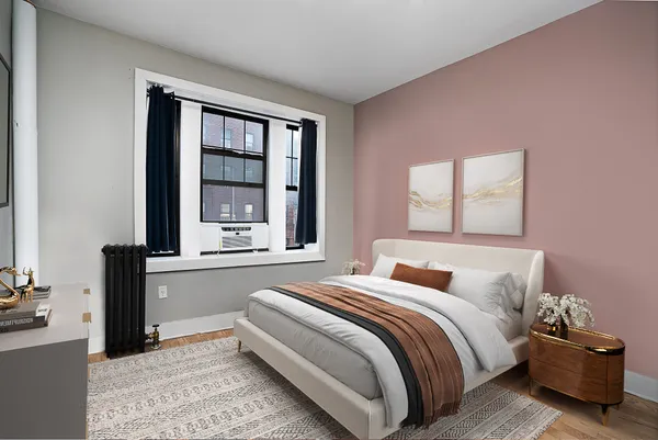 a bedroom with a bed and window