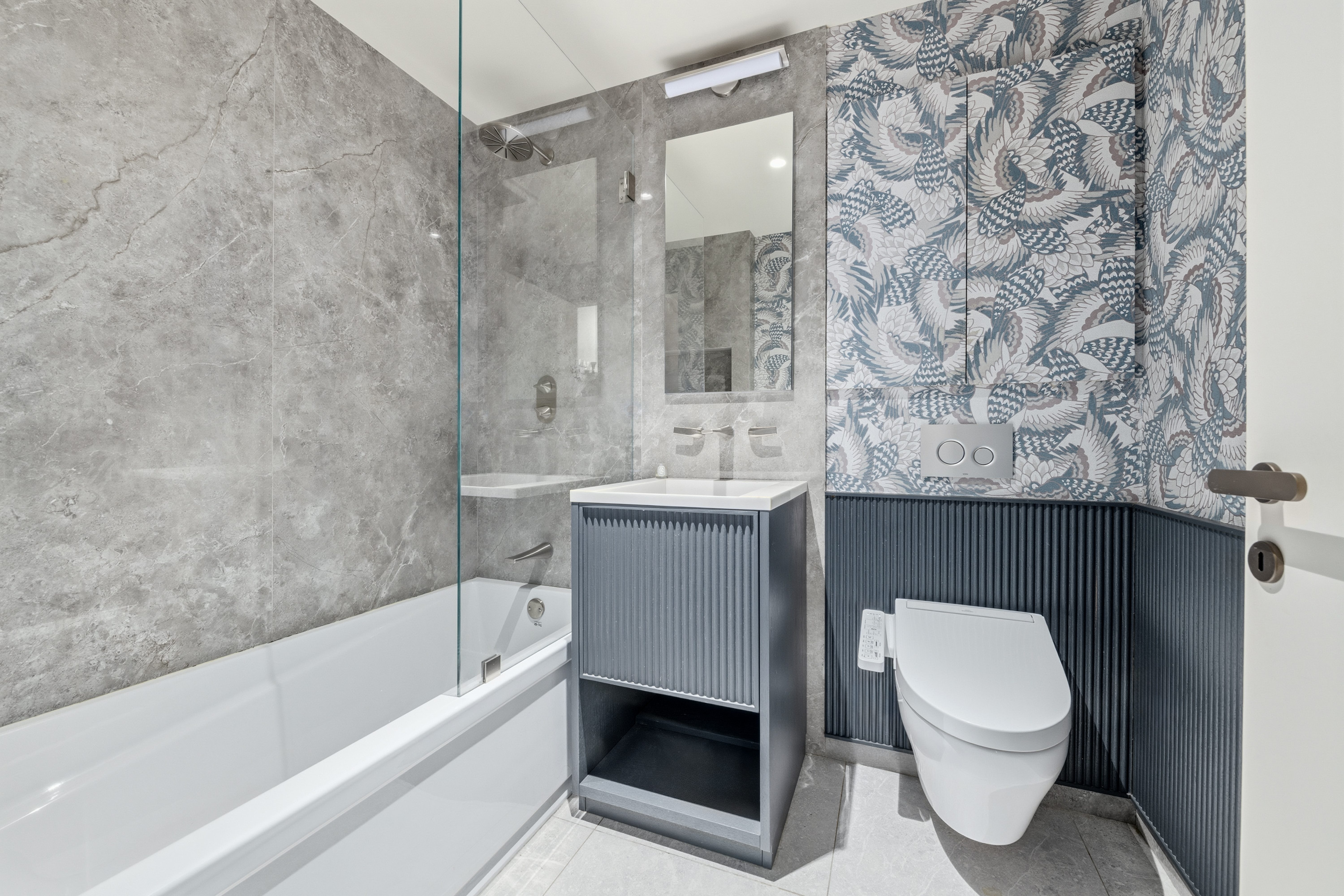 1 Great Jones St, Unit 2B Manhattan, NY 10012 - Photo 10 of 12 a bathroom with a sink toilet and shower