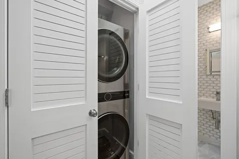 a close view of a utility room with washer and dryer