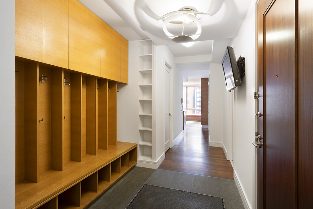 30 West Street, Unit 21AB Manhattan, NY 10004 - Photo 6 of 17 a view of a hallway with wooden floor