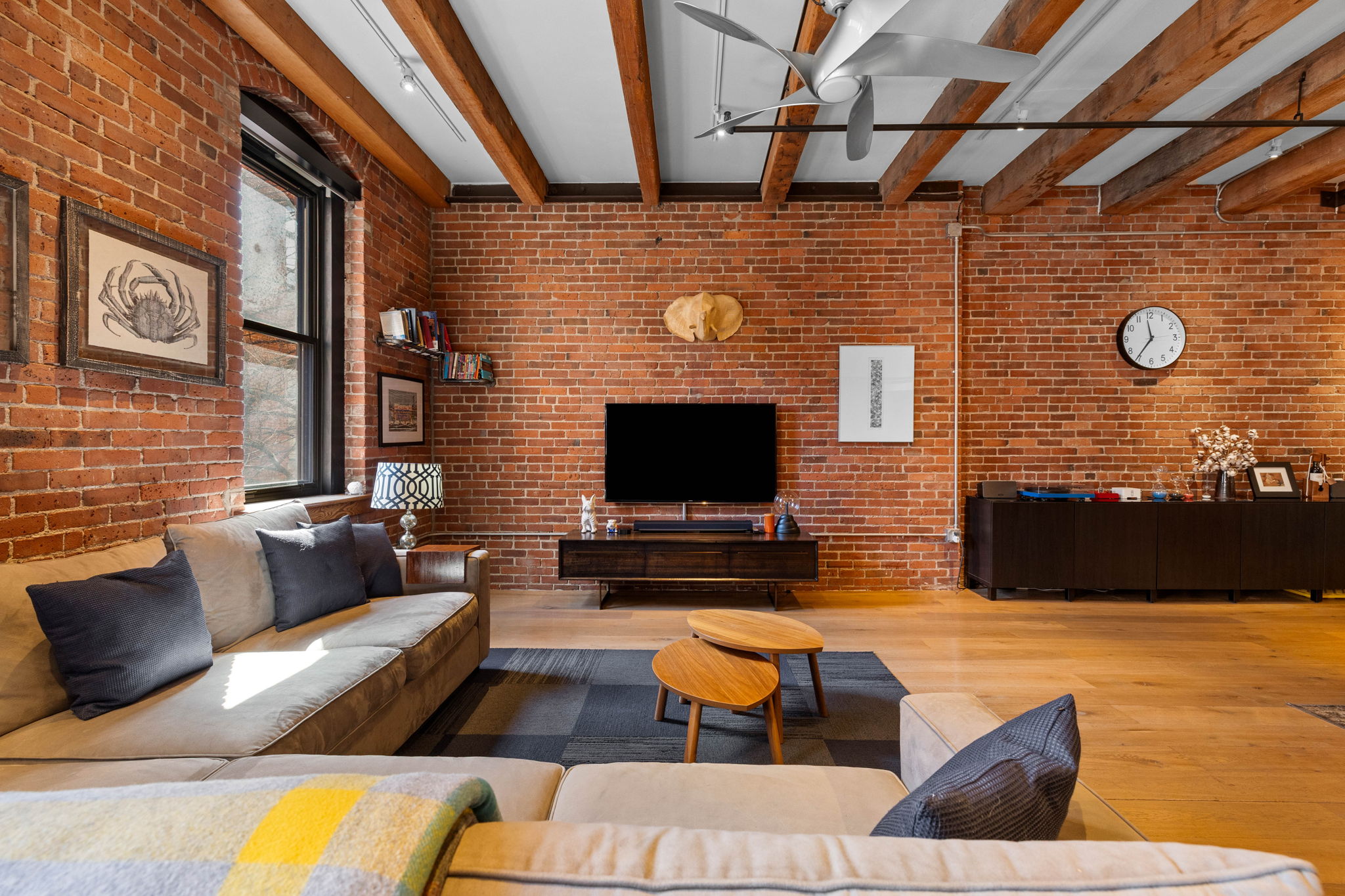 33 Sleeper Street, Unit 307 Boston, MA 02210 - Photo 9 of 15 a outdoor living space with patio furniture and a fireplace