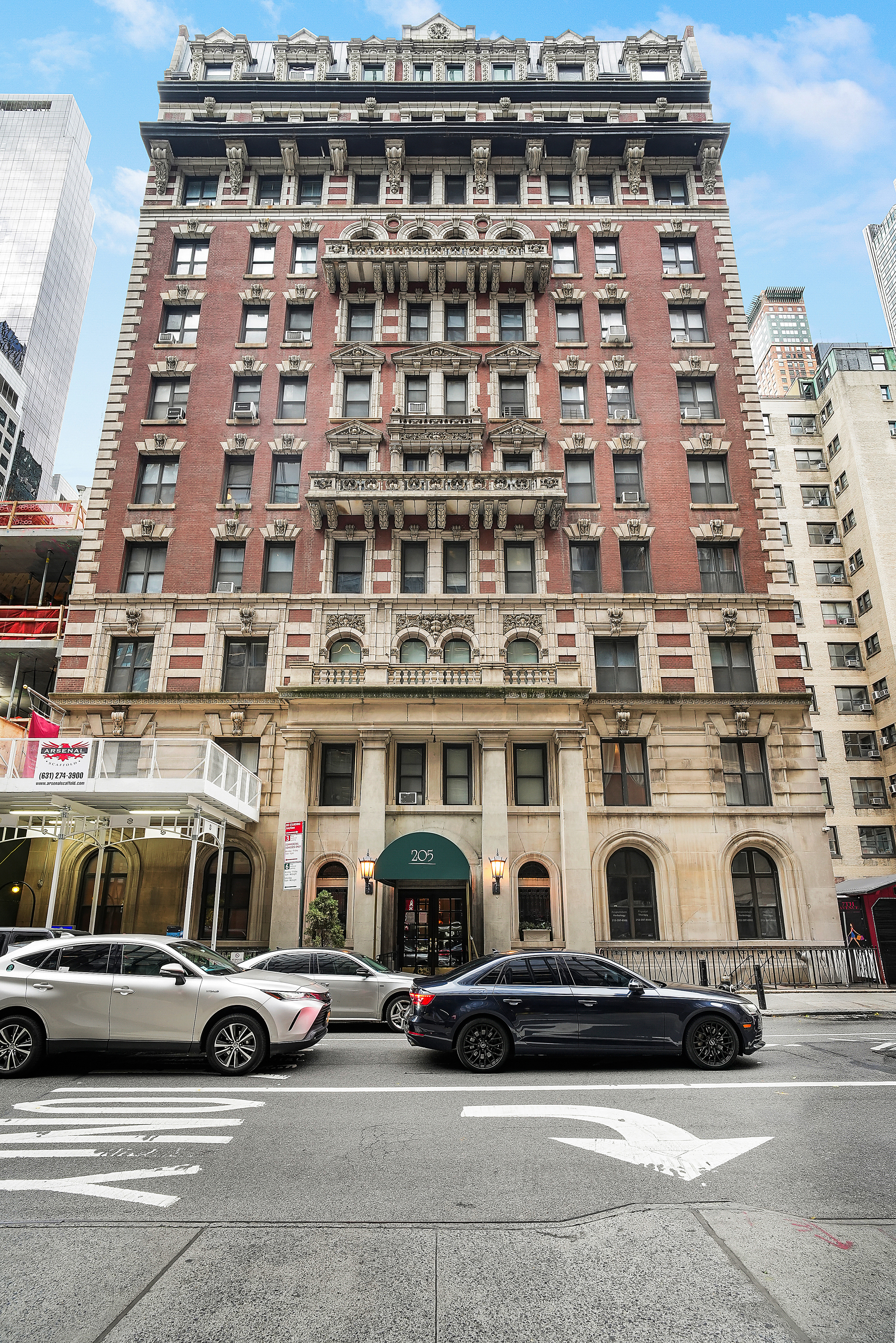 205 West 54th Street, Unit 3A Manhattan, NY 10019 - Photo 13 of 14 a car parked in front of a building
