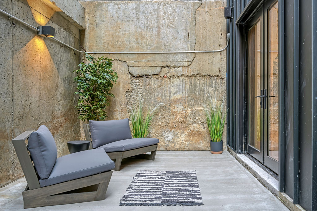 459 Harman Street, Unit 1 Manhattan, NY 10026 - Photo 14 of 17 a living room with furniture and a gate
