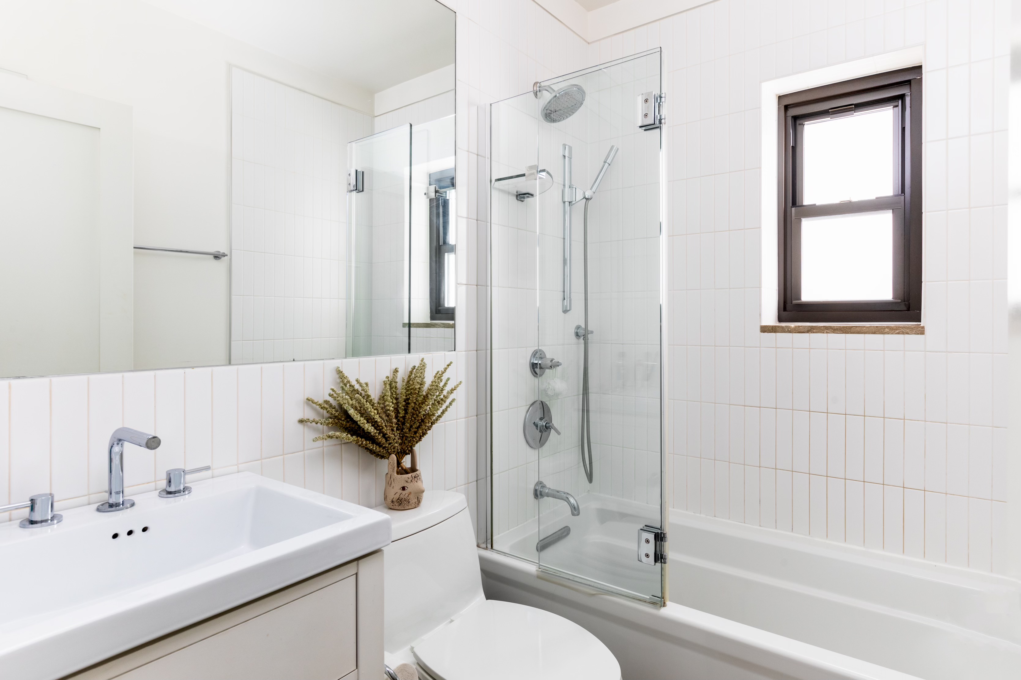 422 West 20th Street, Unit 3G Manhattan, NY 10011 - Photo 9 of 15 a bathroom with a toilet sink and shower