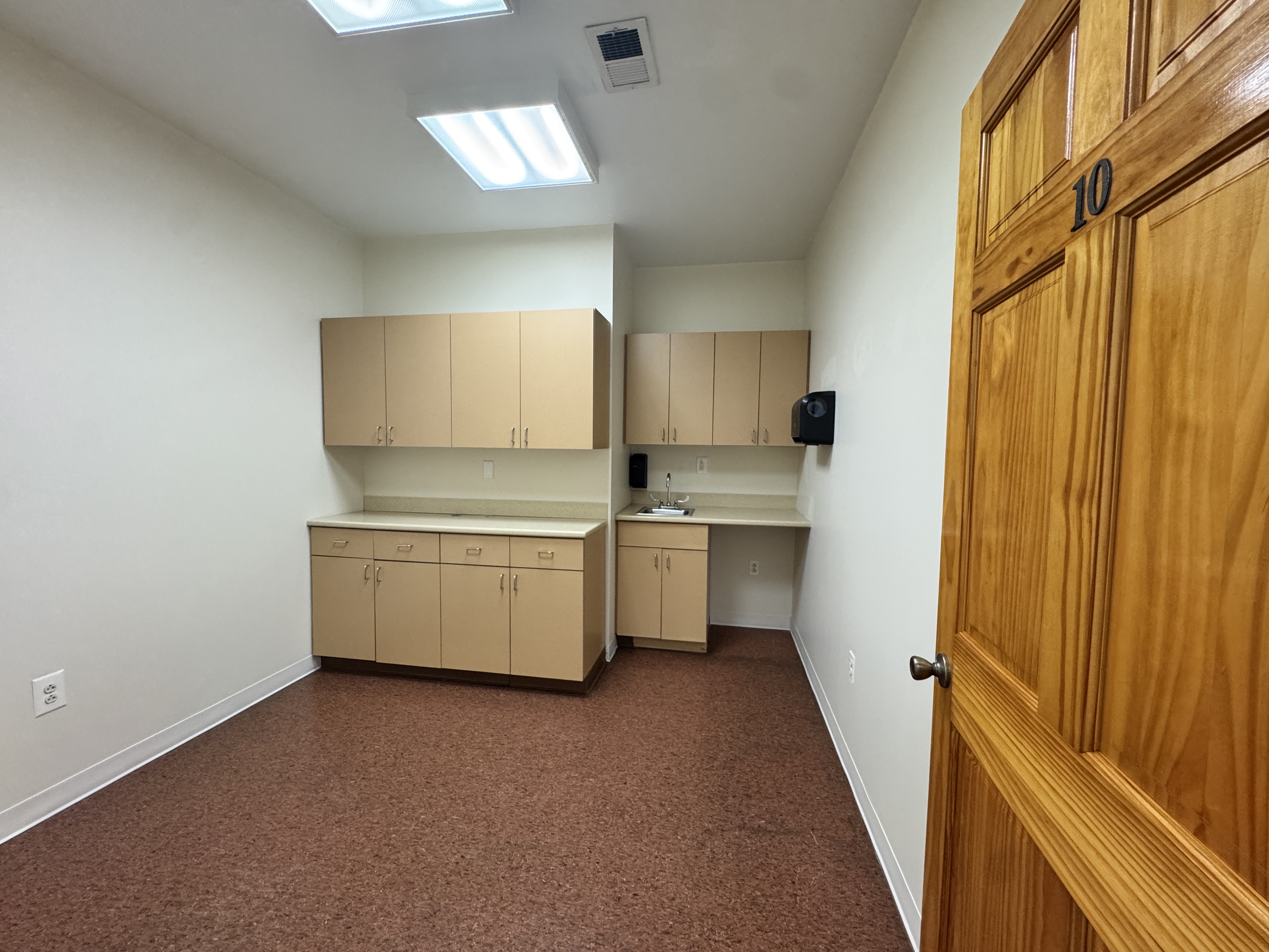 406 15th Street, Unit M1 Brooklyn, NY 11215 - Photo 14 of 19 a kitchen with a stove a sink and a refrigerator