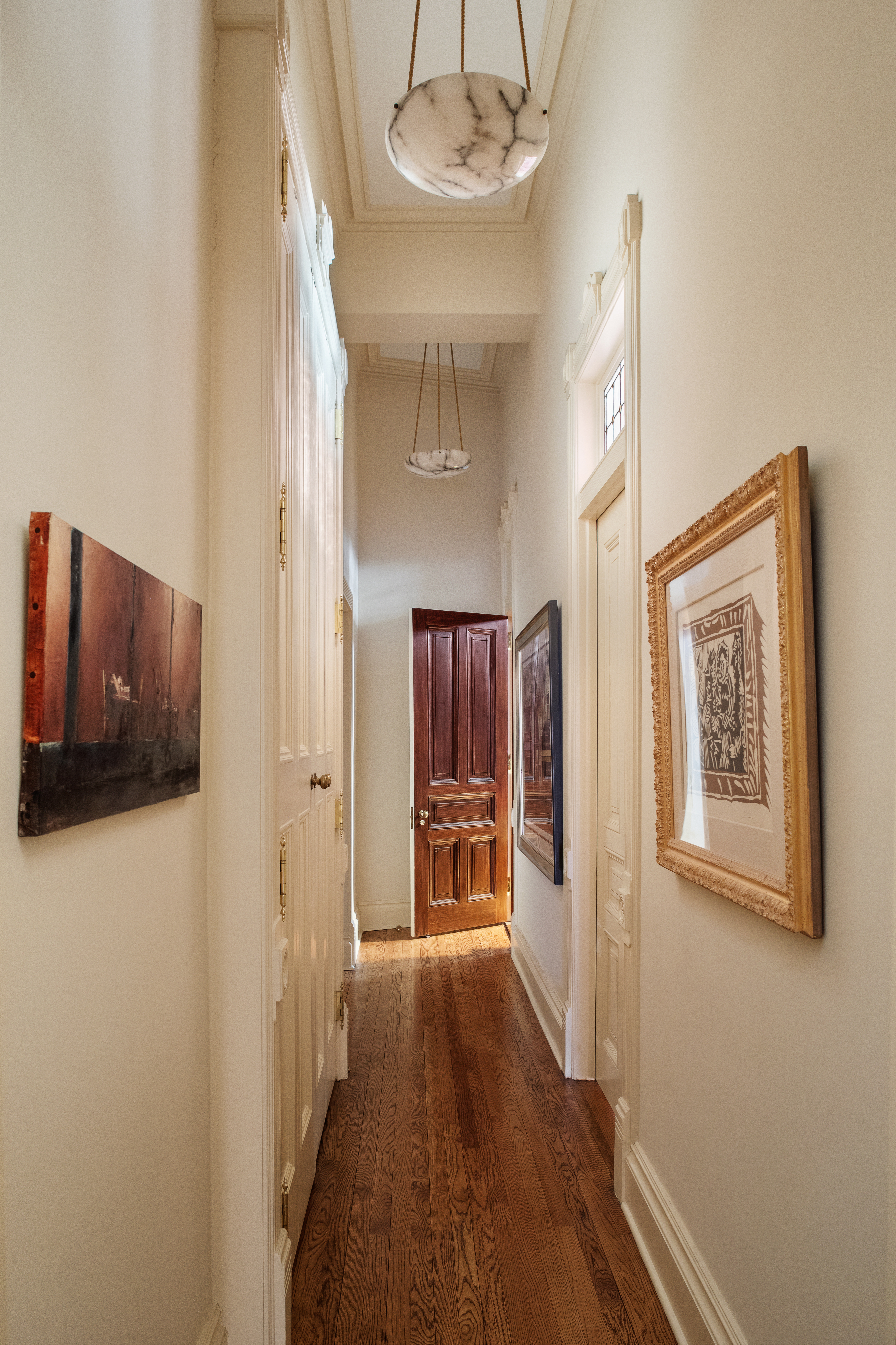 34 Gramercy Park East, Unit MAF Manhattan, NY 10010 - Photo 5 of 17 a view of a hallway with wooden floor and cabinet