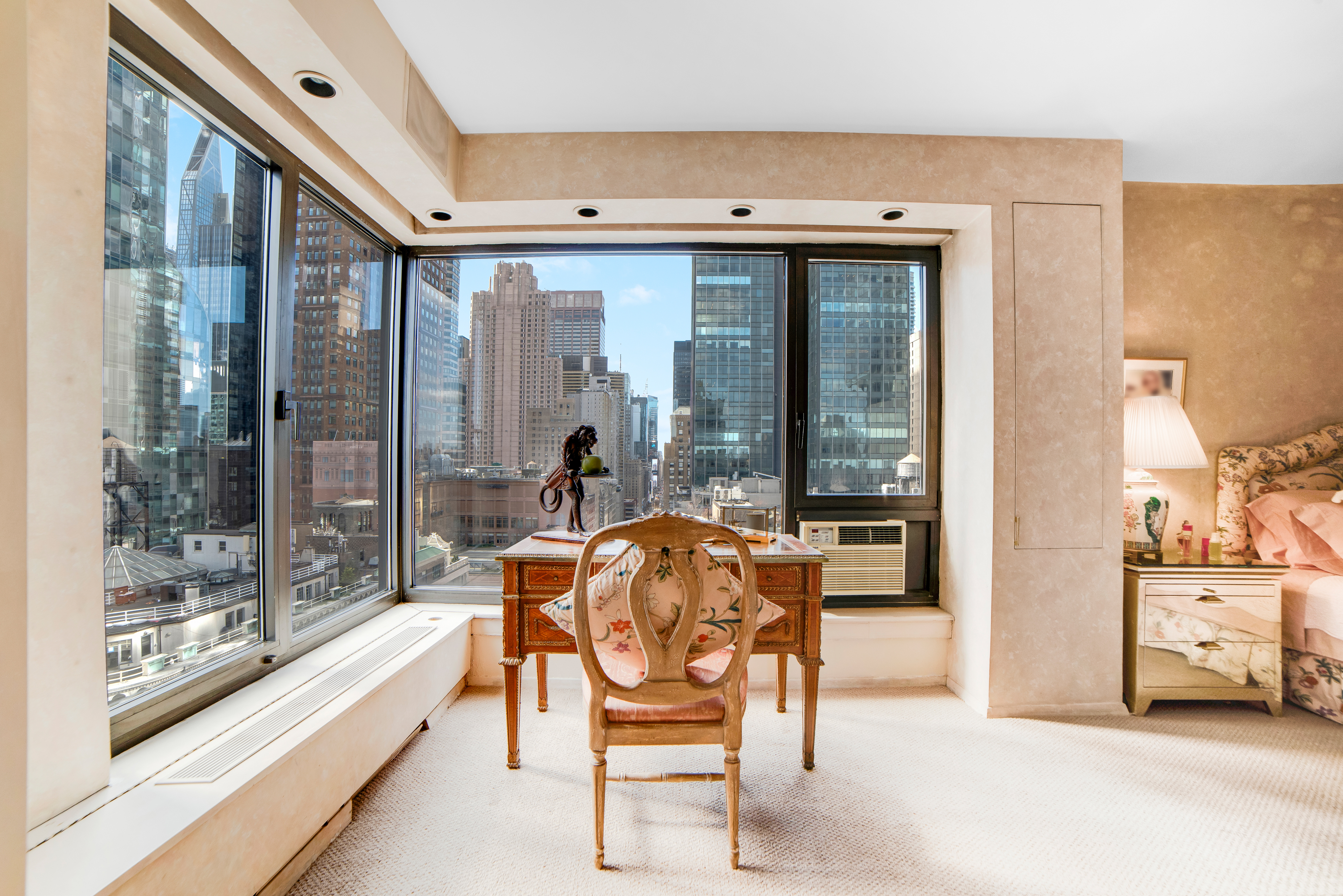 200 Central Park South, Unit 24A Manhattan, NY 10019 - Photo 20 of 23 a outdoor space with a large window and couch