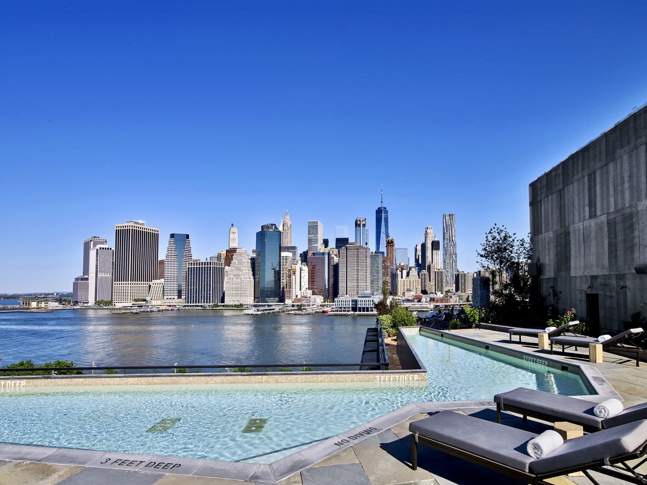 90 Furman Street, Unit N510 Brooklyn, NY 11201 - Photo 25 of 31 a view of a swimming pool with outdoor seating