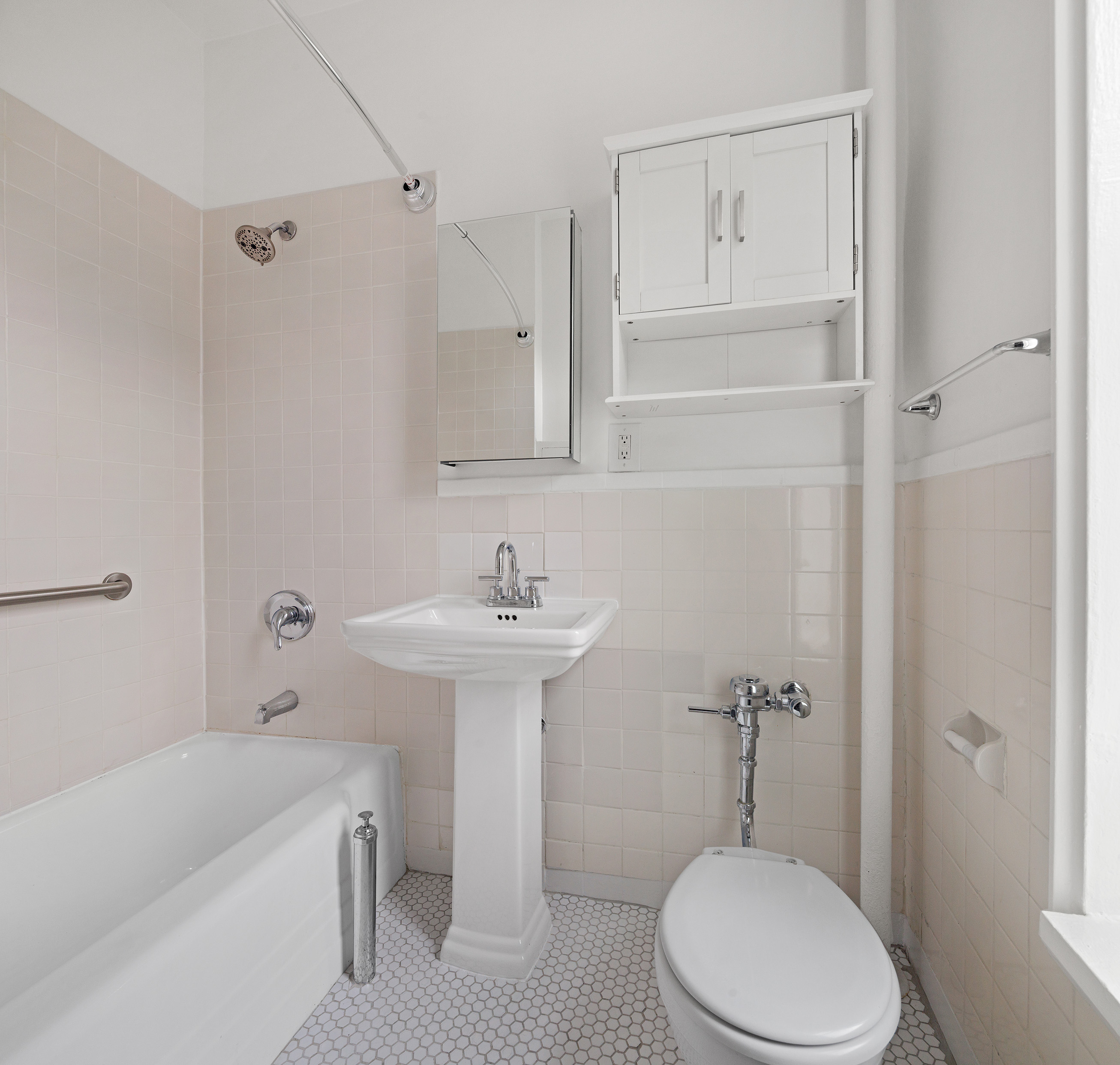 10 Bethune Street, Unit 2B Manhattan, NY 10014 - Photo 6 of 7 a bathroom with a sink a toilet and shower