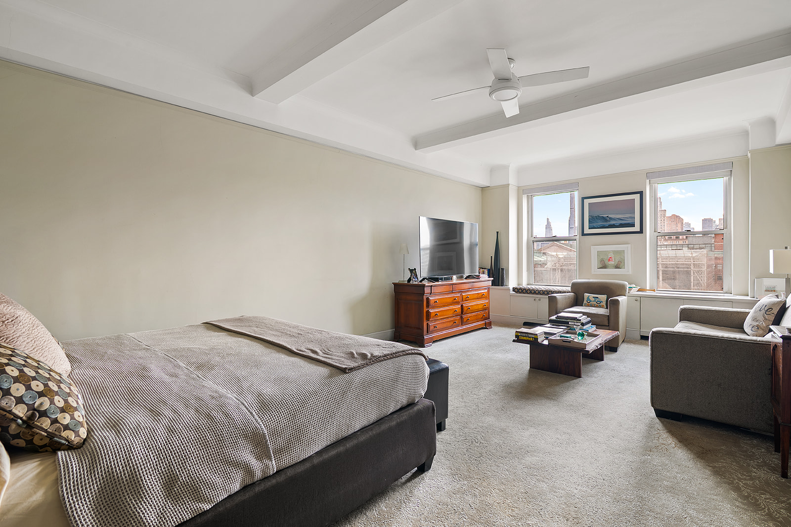 15 West 81st Street, Unit 10B Manhattan, NY 10024 - Photo 5 of 19 a bedroom with bed couch and large window