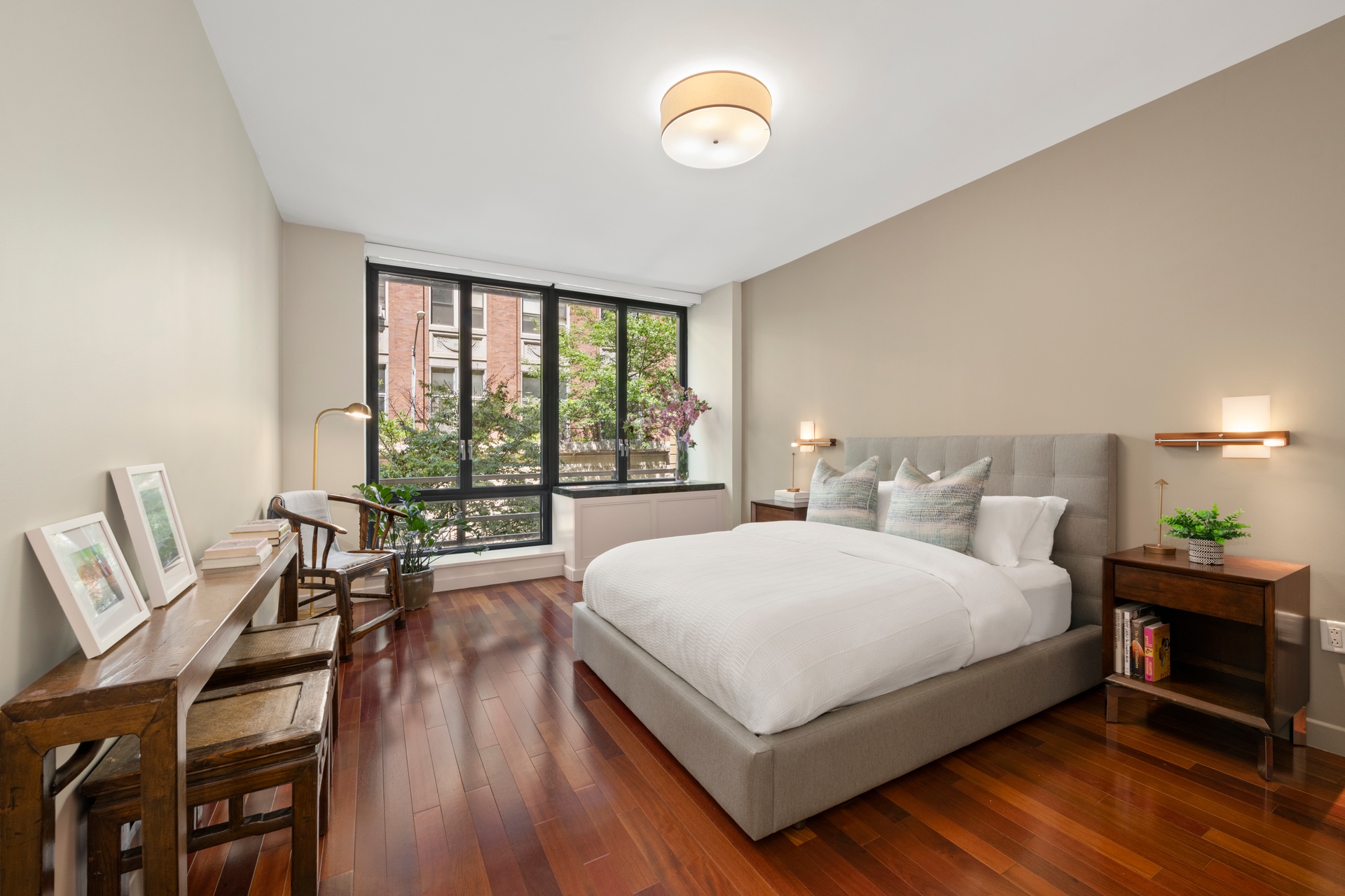 50 West 15th Street, Unit 2D Manhattan, NY 10011 - Photo 4 of 15 a large bedroom with a bed and a table