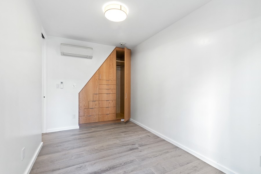 128 West 70th Street, Unit 10 Manhattan, NY 10023 - Photo 8 of 15 a view of an entryway with wooden floor