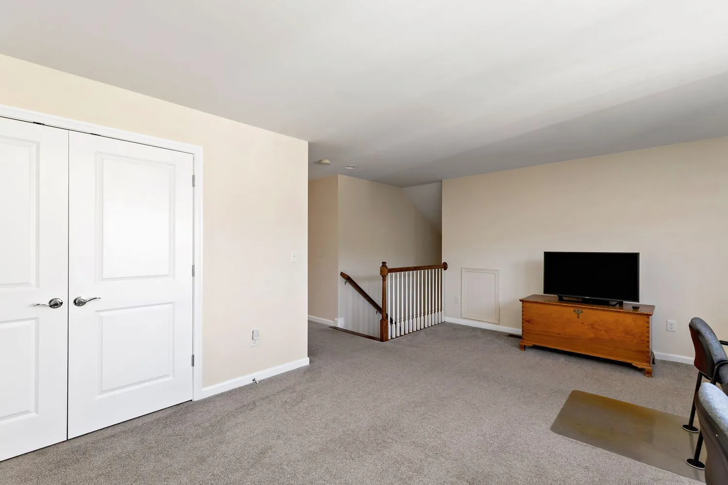 a view of room with workspace and windows