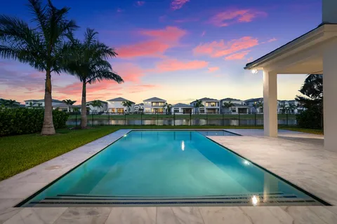 a view of outdoor space with swimming pool and seating