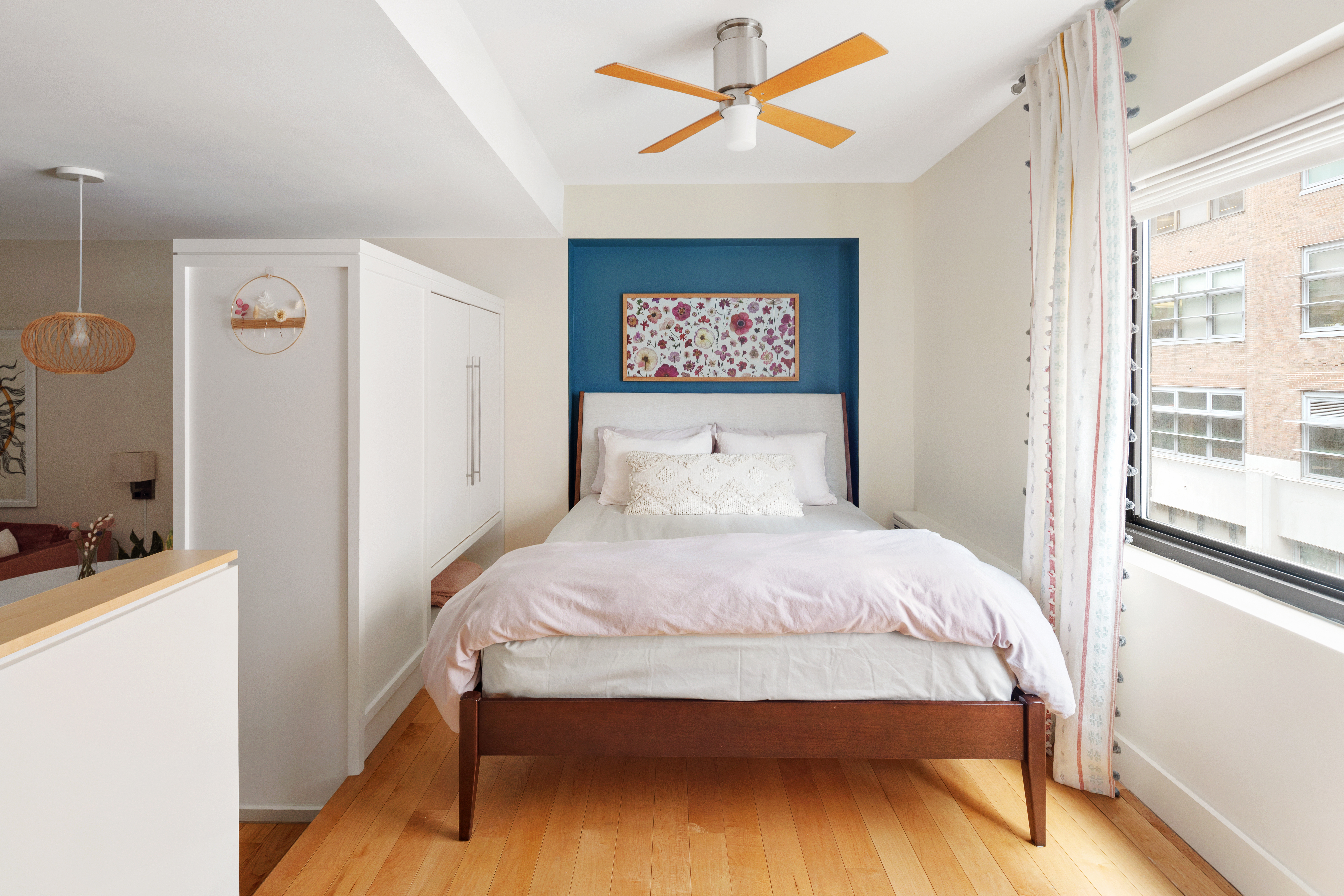 85 8th Avenue, Unit 5H Manhattan, NY 10011 - Photo 3 of 7 a bedroom with a bed and a window