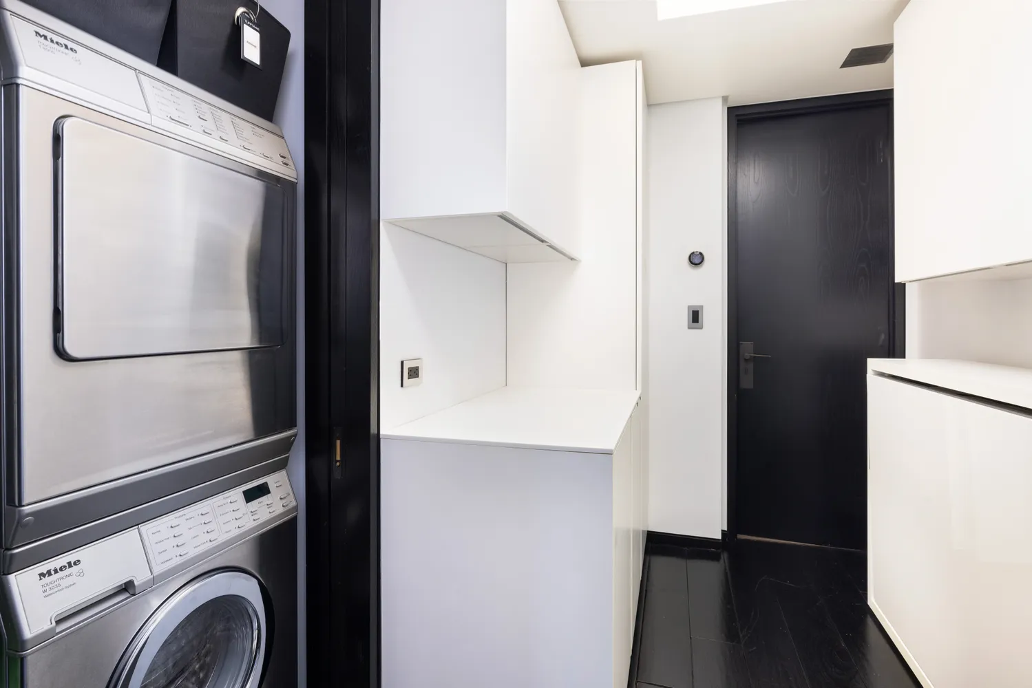 a view of bathroom with washer and dryer