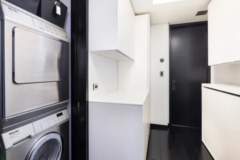 a view of bathroom with washer and dryer