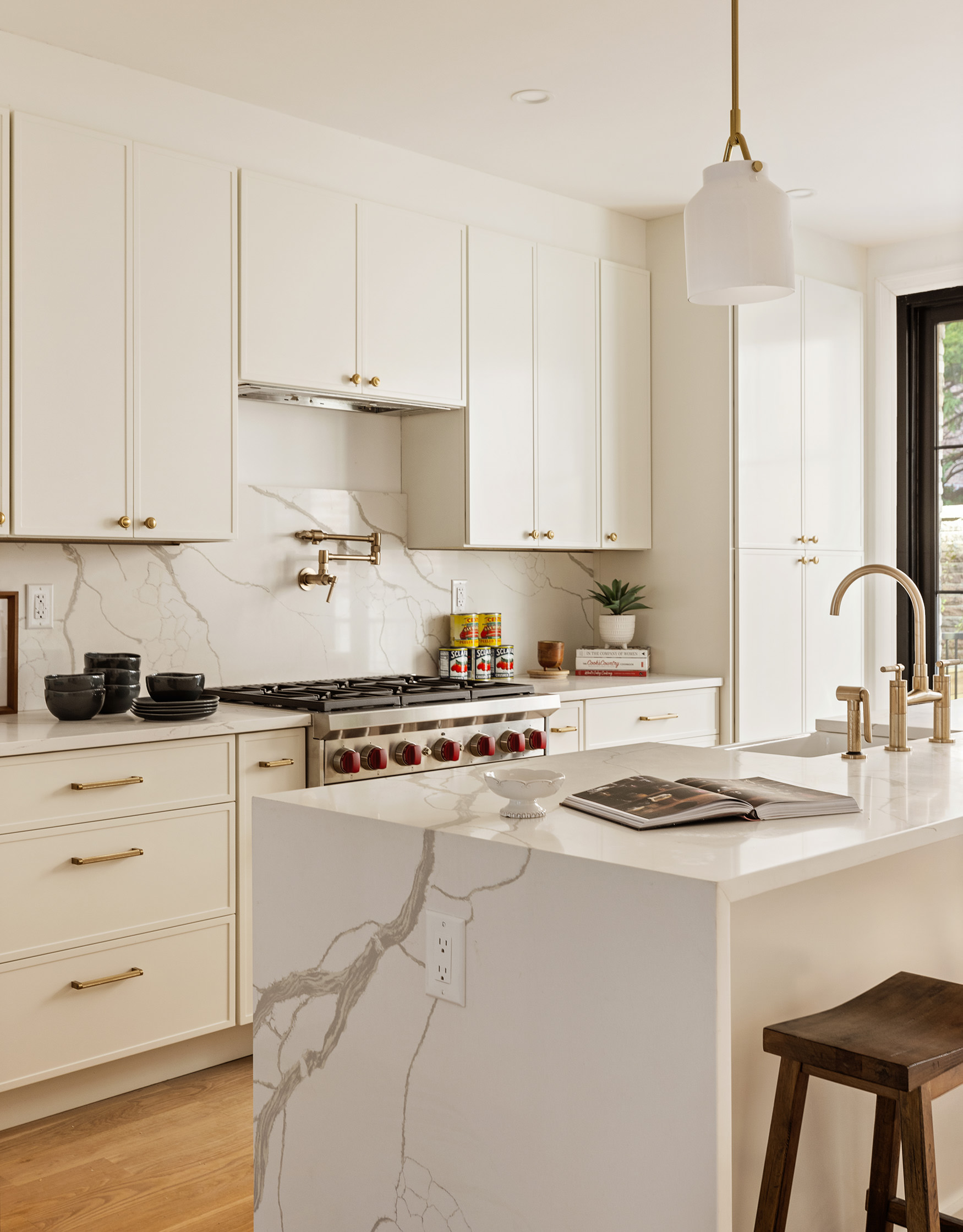 243 East 7th Street Brooklyn, NY 11218 - Photo 6 of 19 a kitchen with granite countertop white cabinets and white appliances