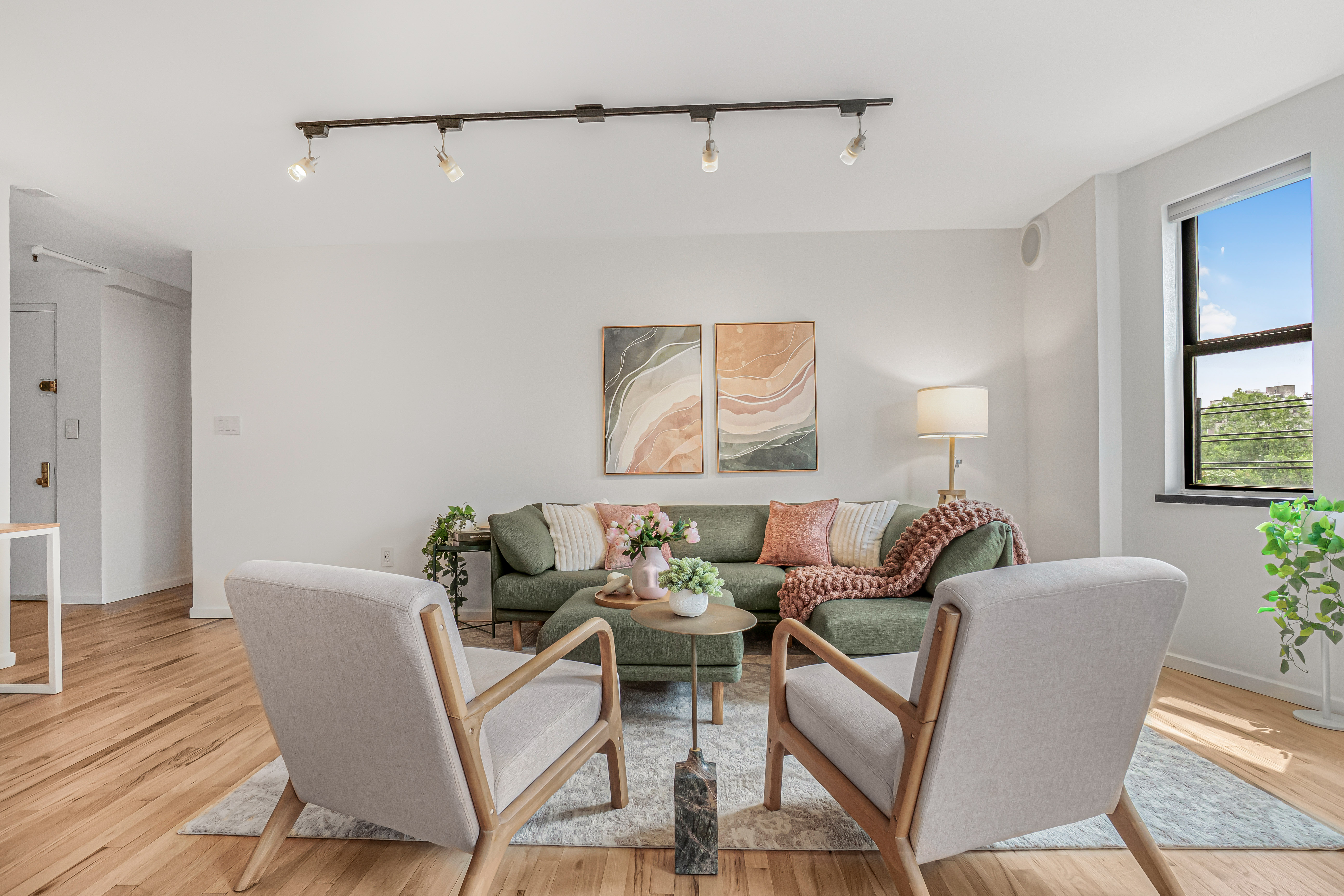 7 Gates Avenue, Unit H Brooklyn, NY 11238 - Photo 6 of 20 a living room with furniture and a window