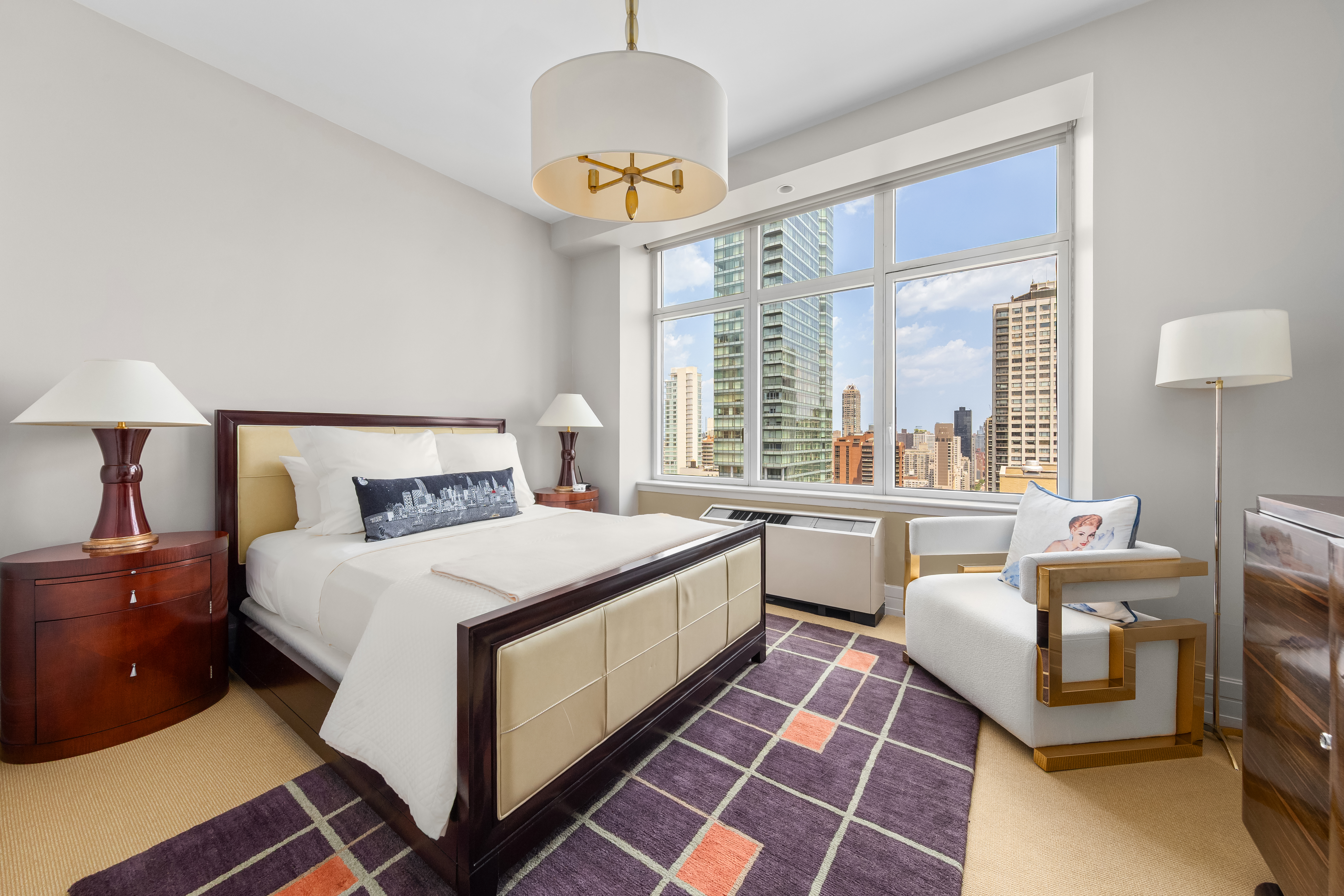 300 East 55th Street, Unit PHC Manhattan, NY 10022 - Photo 12 of 21 a bedroom with a bed and a chandelier