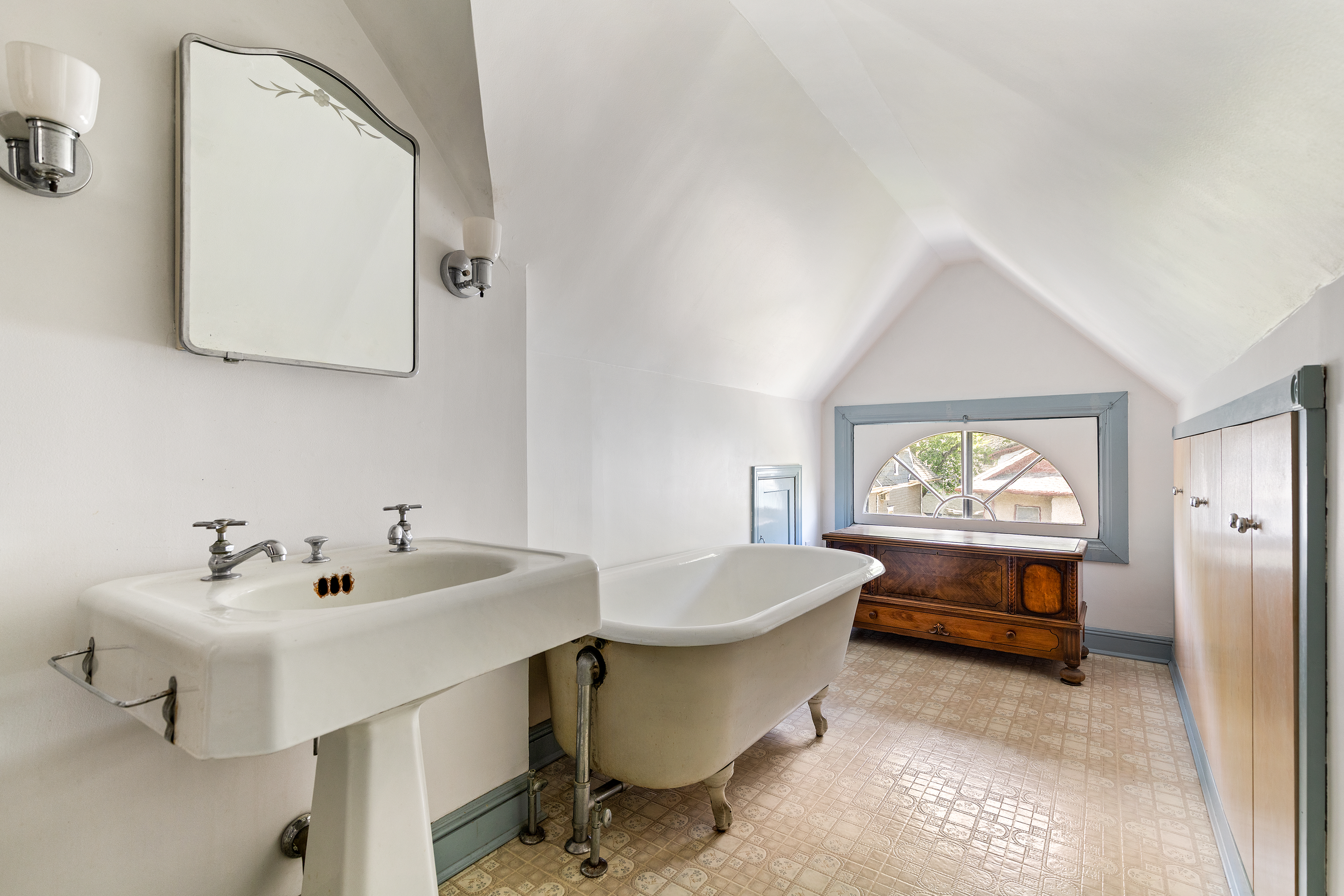 492 Westminster Road Brooklyn, NY 11218 - Photo 15 of 21 a bathroom with a sink and a mirror