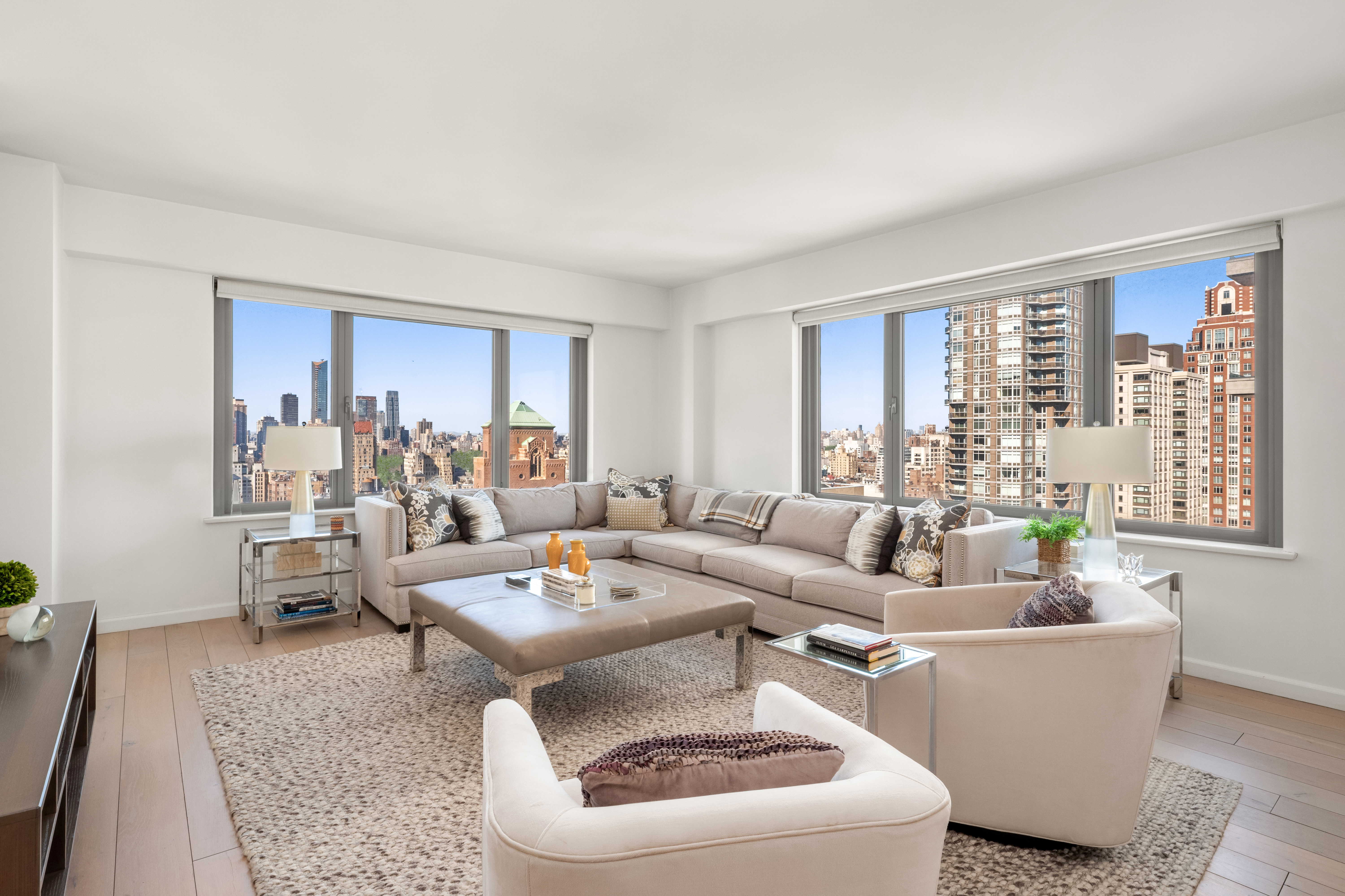 200 East 62nd Street, Unit 27A Manhattan, NY 10065 - Photo 1 of 19 a living room with furniture and a large window