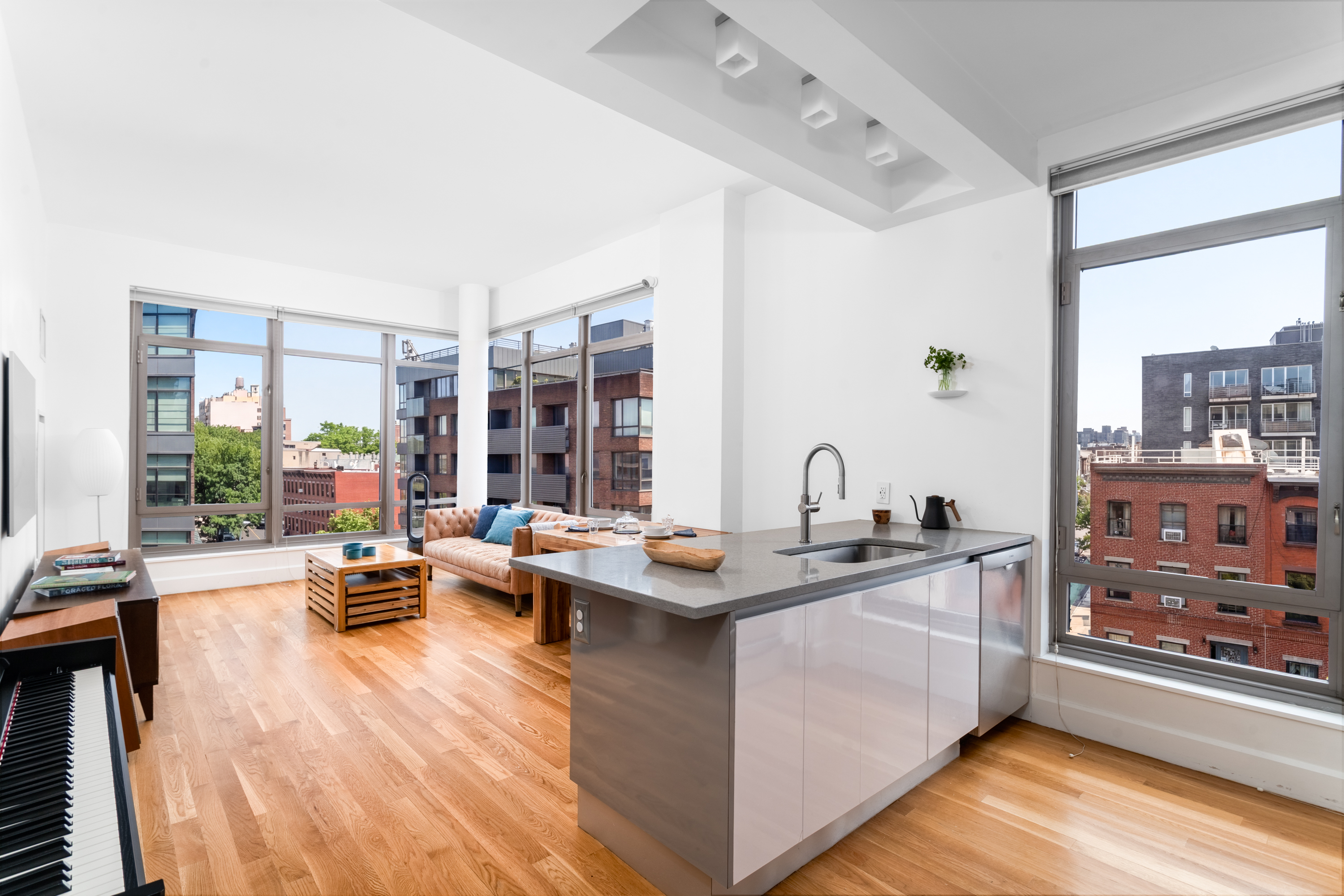 315 Gates Avenue, Unit 4E Brooklyn, NY 11216 - Photo 1 of 17 a kitchen with stainless steel appliances granite countertop a stove and cabinets