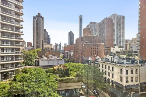 a view of city with tall buildings