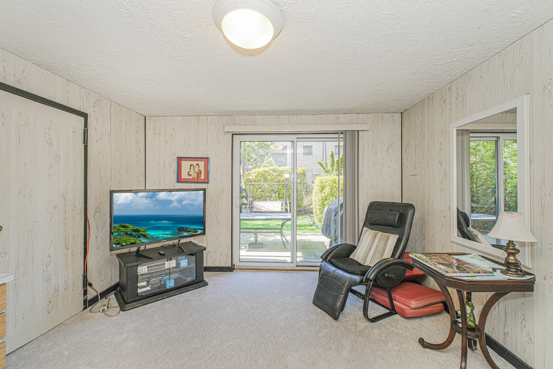 97 Dogwood Lane Staten Island, NY 10305 - Photo 13 of 22 a living room with furniture a flat screen tv and a window