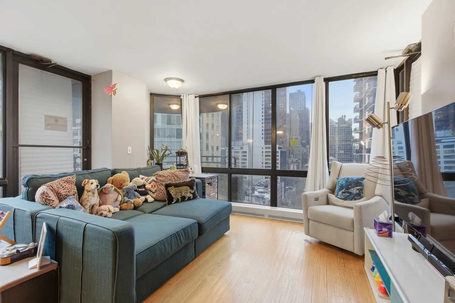 a bedroom with bed couch and window