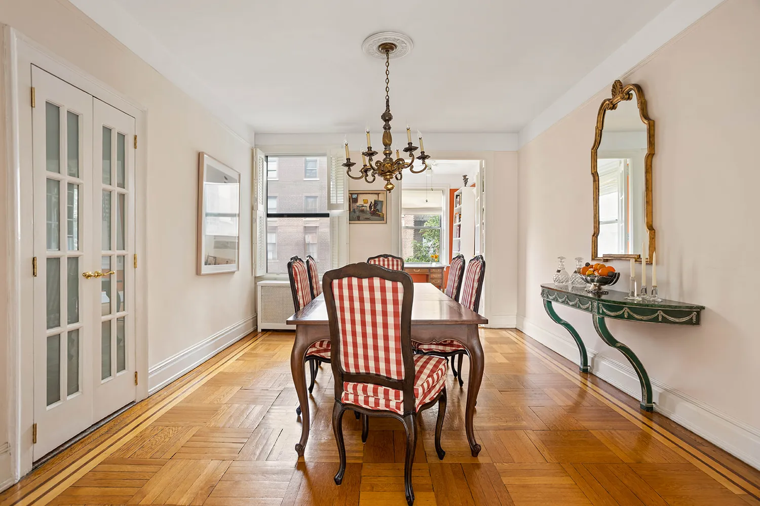 a view of a dining room with furniture and chandelier