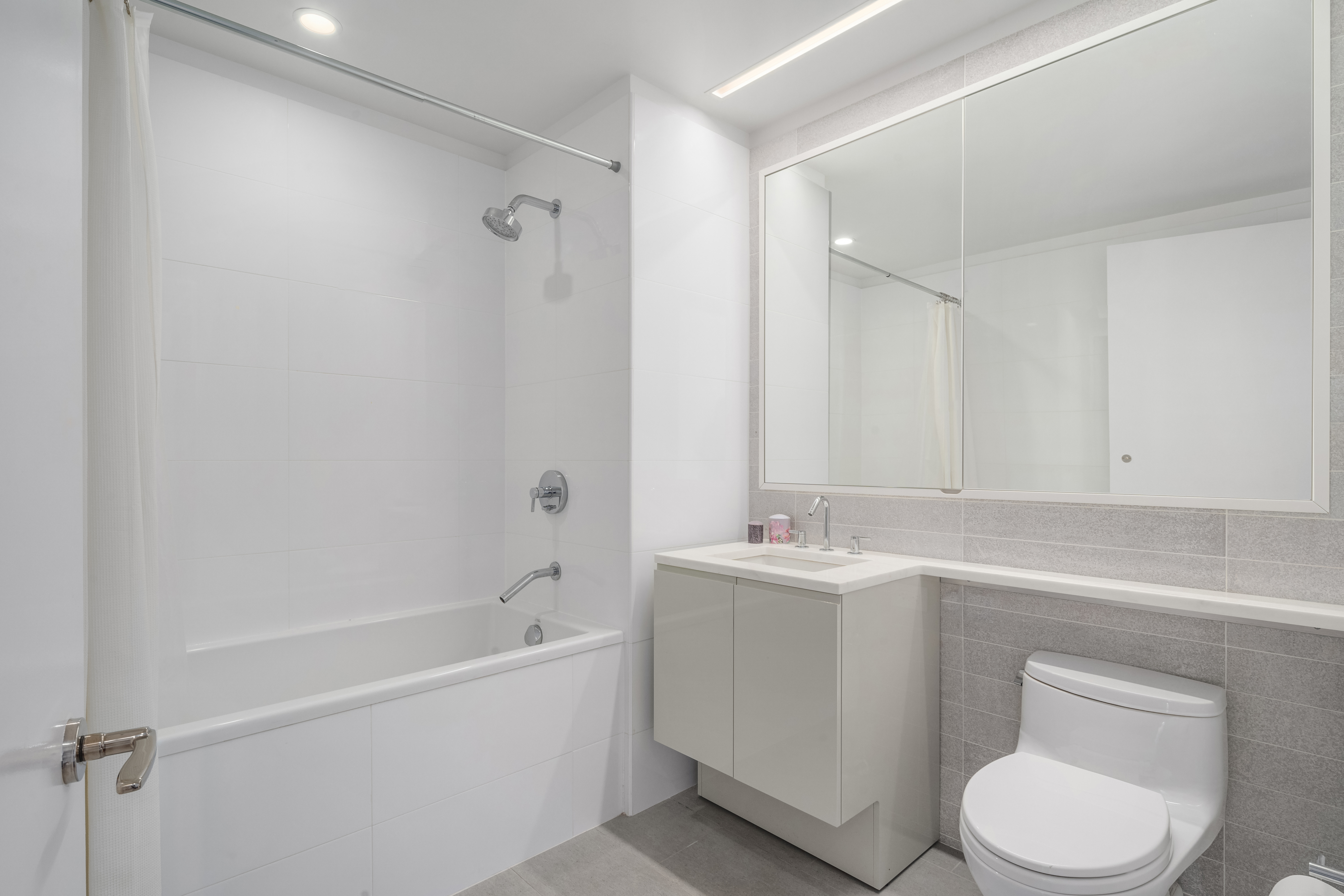 50 Riverside Boulevard, Unit 10P Manhattan, NY 10069 - Photo 14 of 21 a bathroom with a sink a toilet and shower