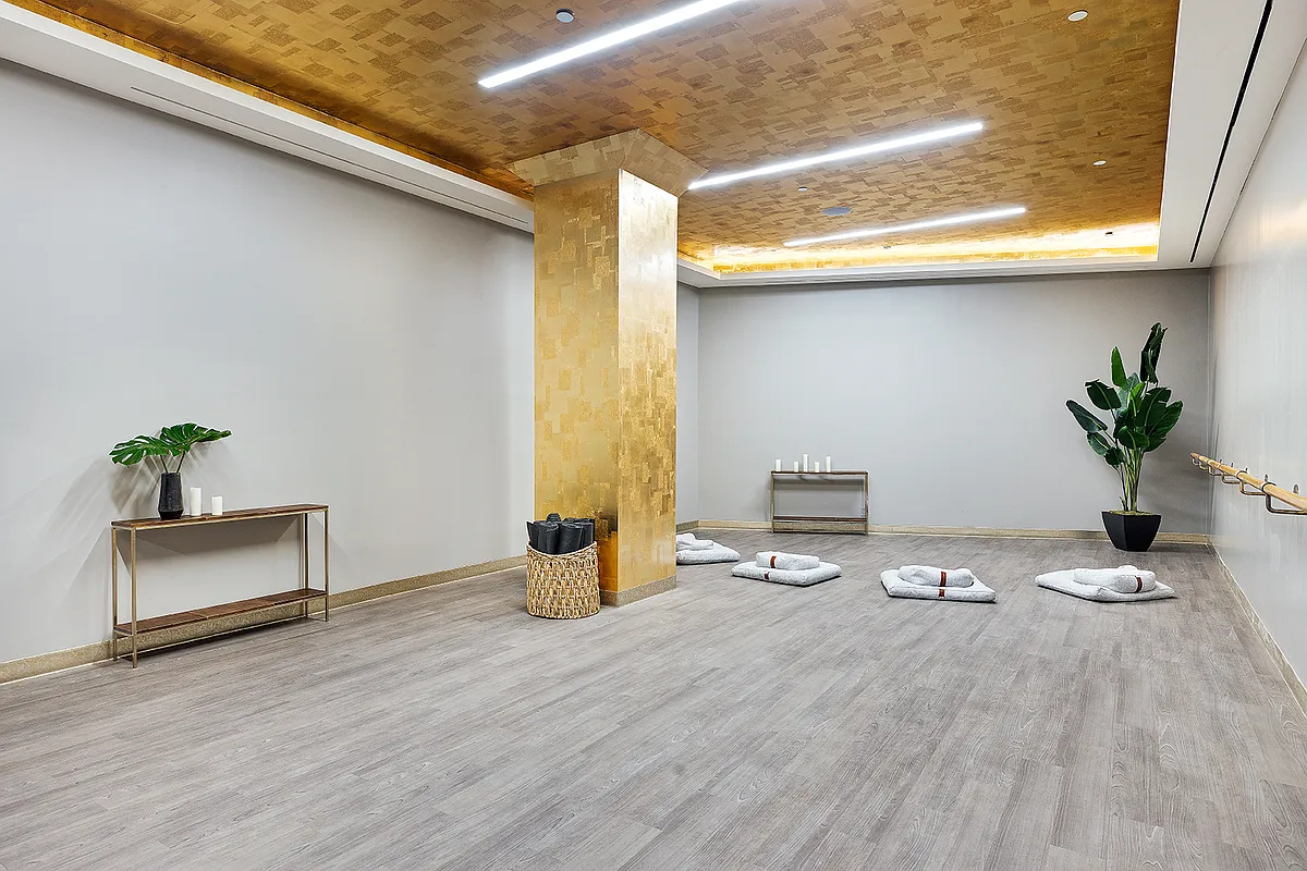 100 Barclay Street, Unit 21AD Manhattan, NY 10007 - Photo 31 of 37 a view of a livingroom with wooden floor and a rug